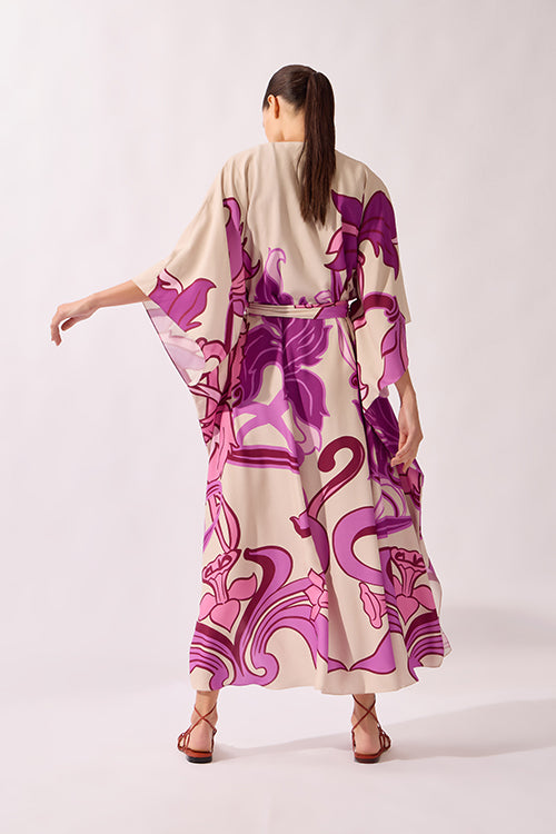 Model wearing the Alpine Flower Maxi Robe back showcasing its unique color on 100% Viscose fabric, styled for an afternoon look.