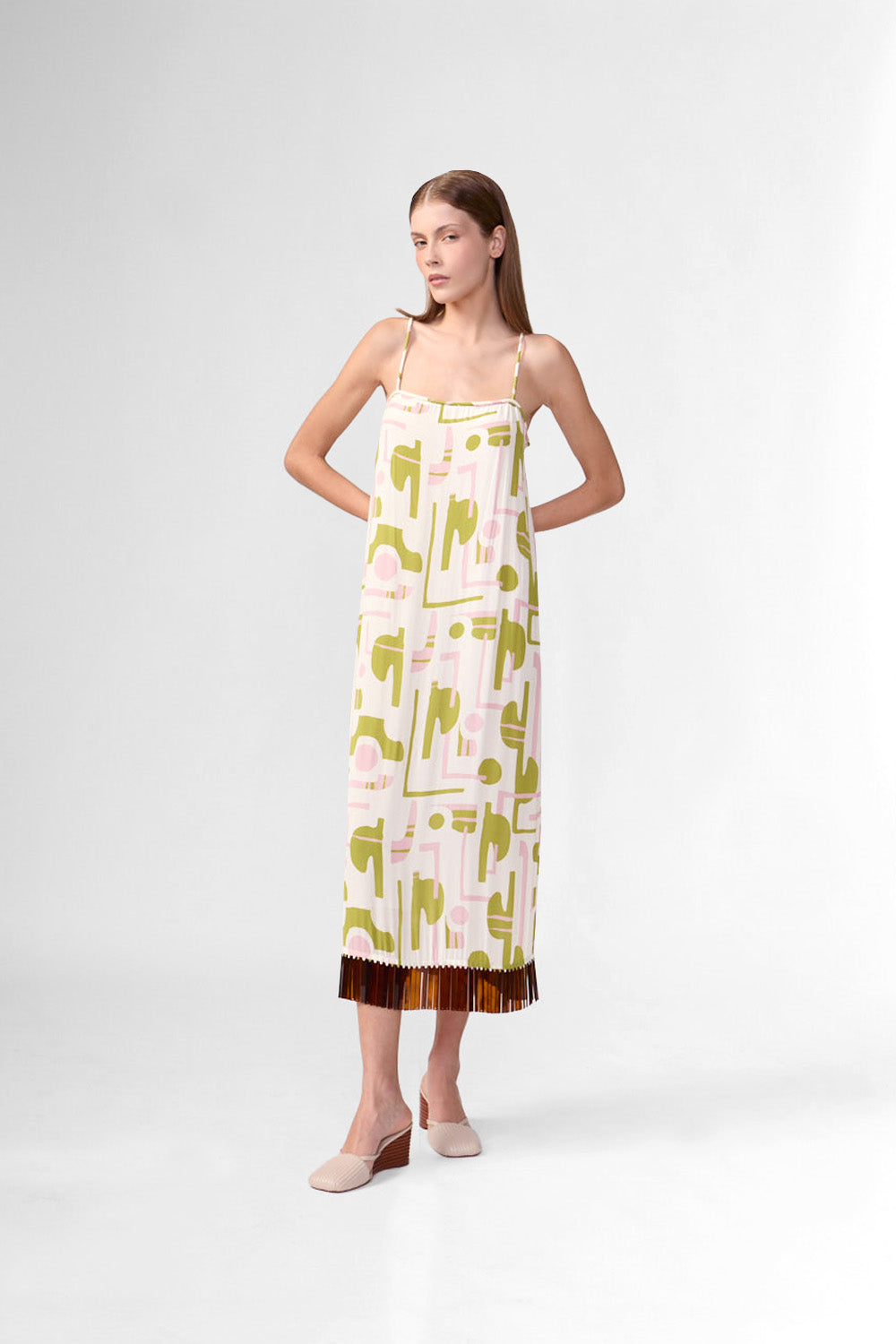 Model wearing the Balearic Acrylic Fringe Midi Dress front, showcasing its unique color made from 100% Viscose fabric, styled for an afternoon look.