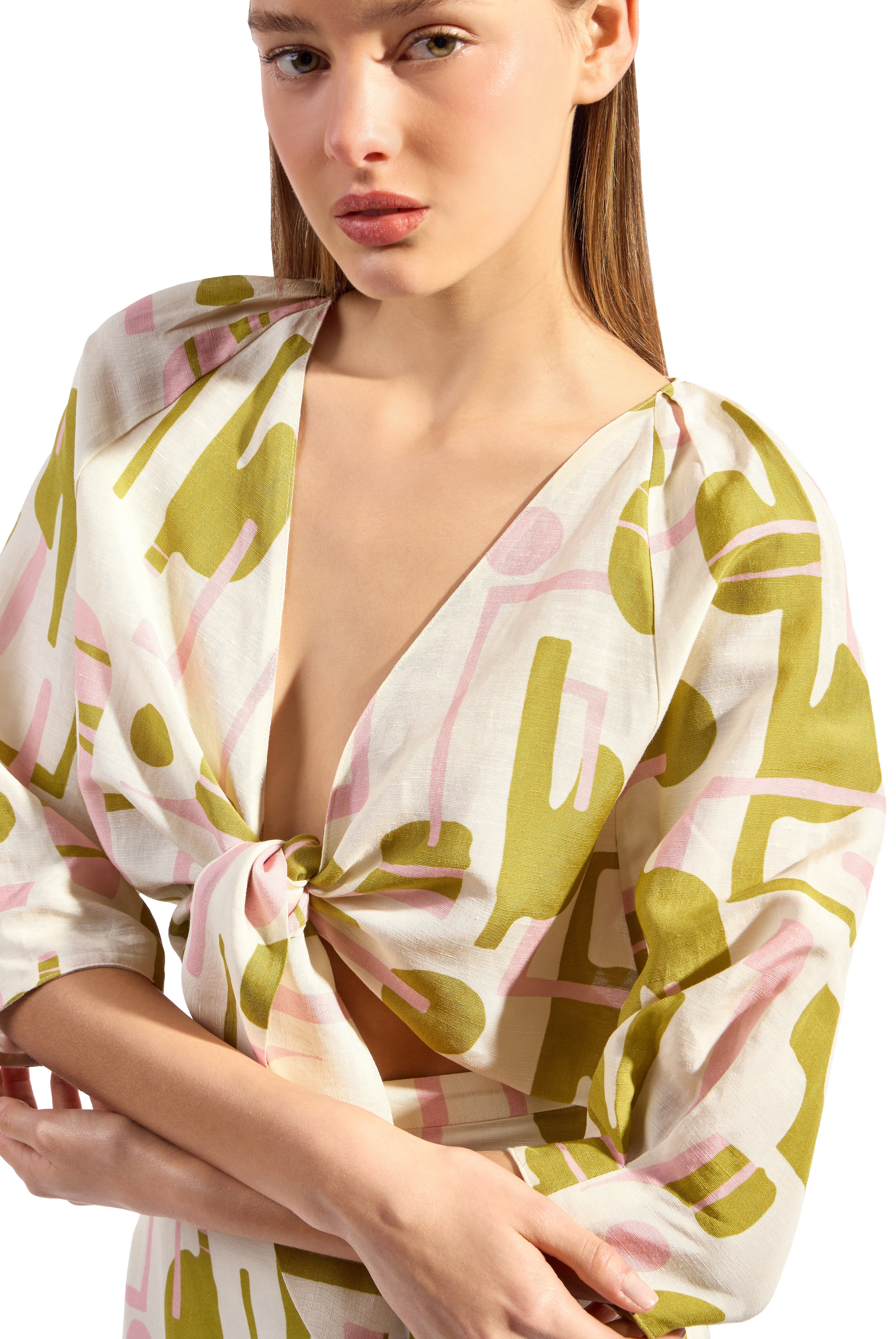 Model wearing the Balearic Front Tie Cropped Top front tie detail color unique made with 56% viscose 44% Linen, styled for resortwear look