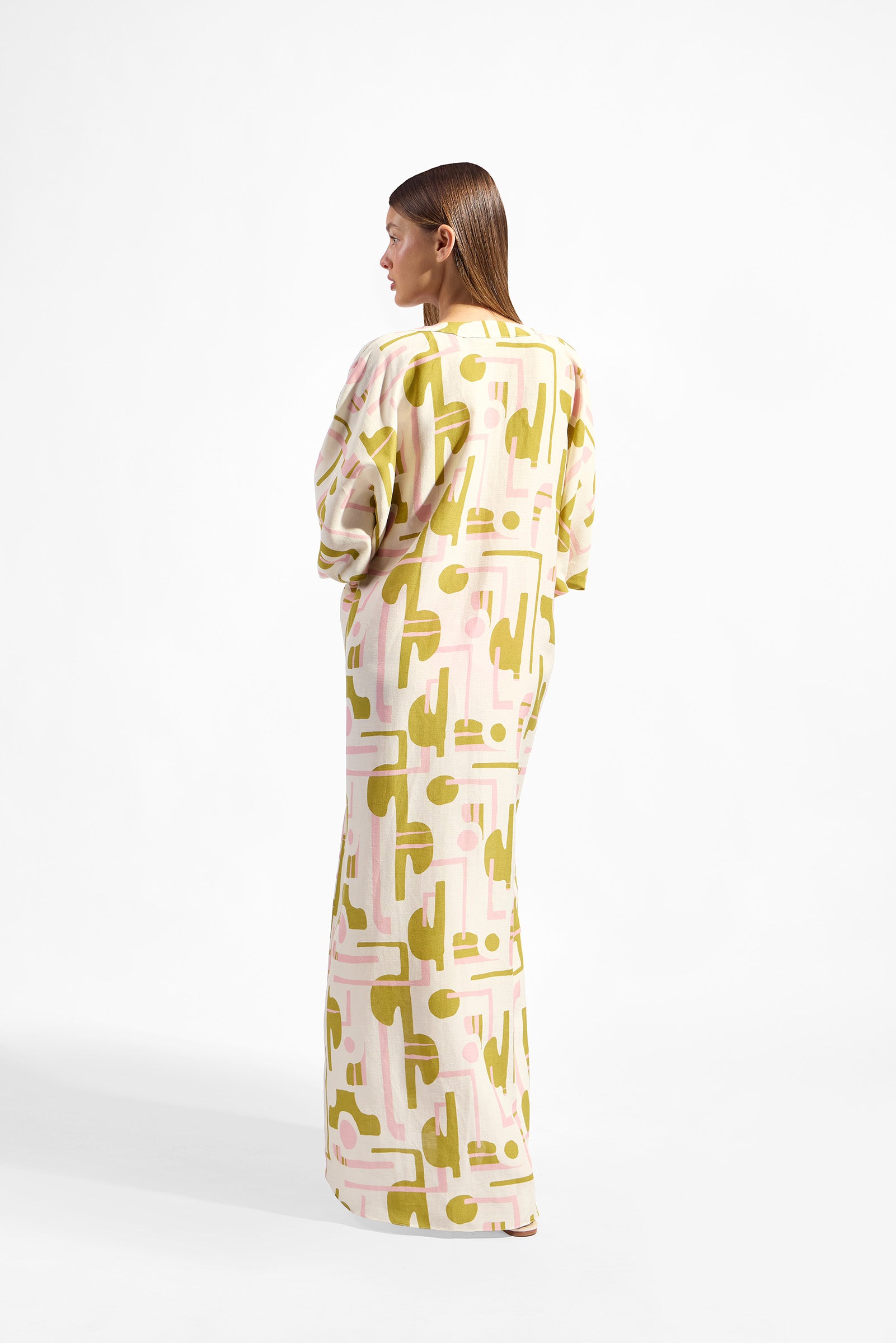 Model wearing the Balearic Maxi Robe back color unique made with 56% viscose 44% Linen, styled for resortwear look