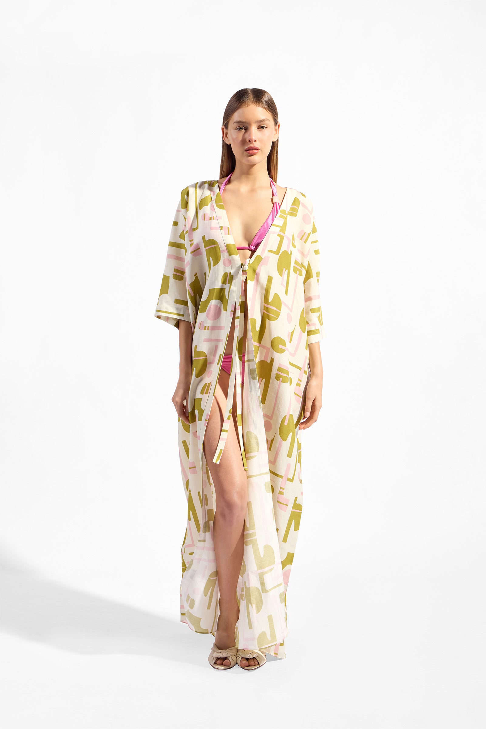 Model wearing the Balearic Maxi Robe front color unique made with 56% viscose 44% Linen, styled for resortwear look