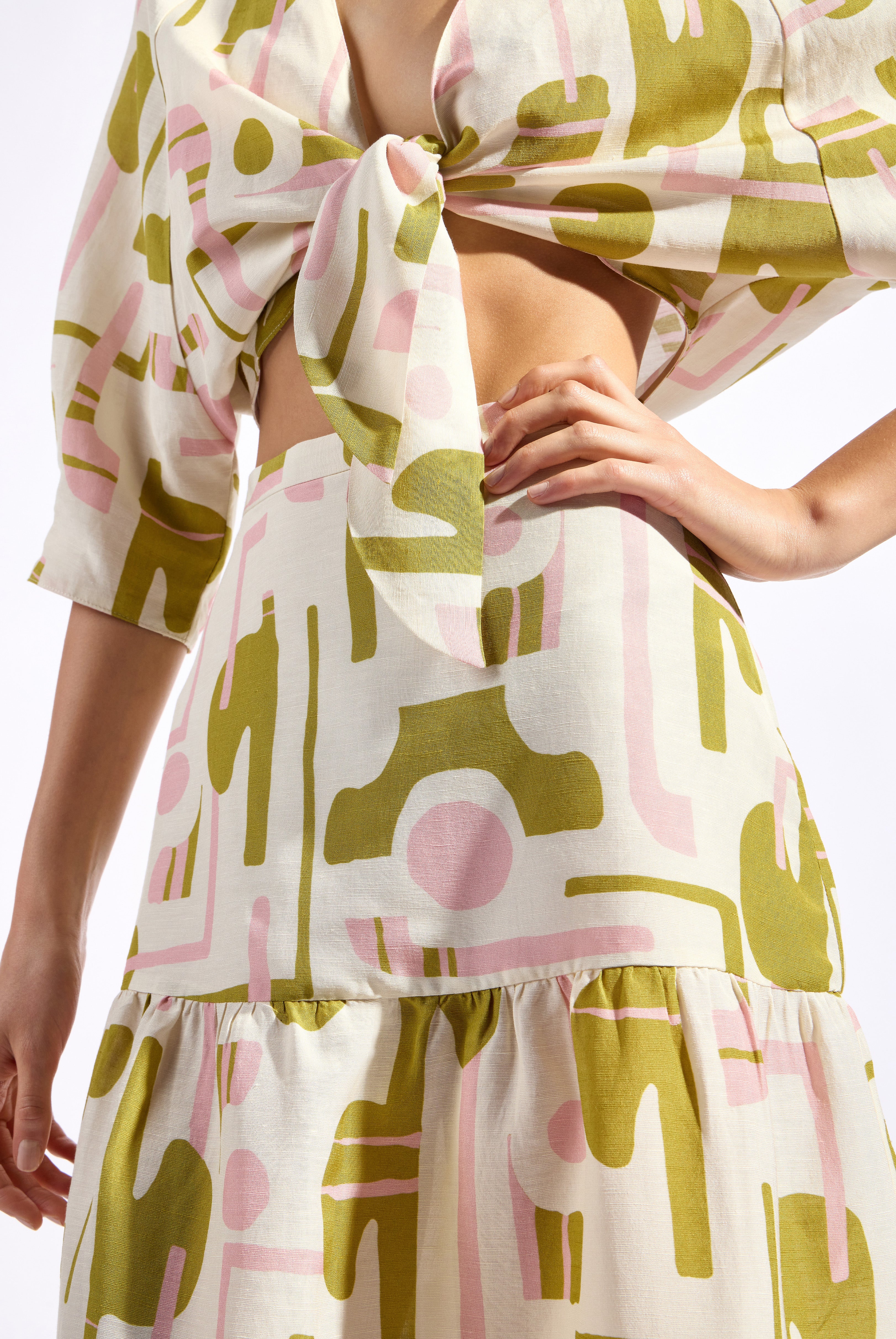 Model wearing the Balearic Midi Skirt detail color unique made with 56% viscose 44% Linen, styled for resortwear look