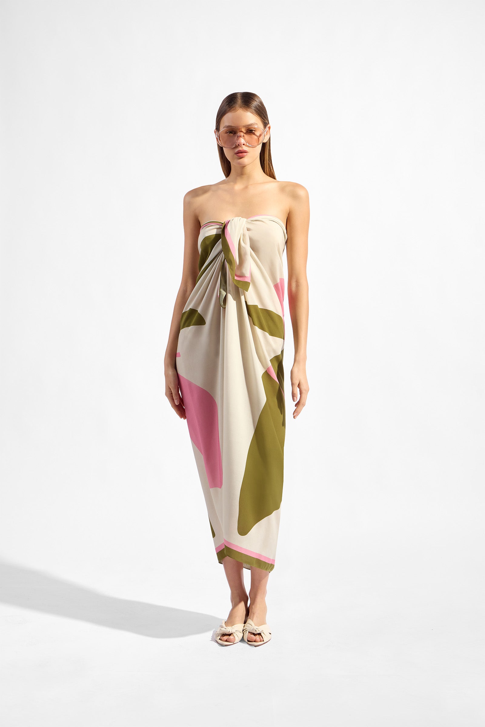 Model wearing the Balearic Panneau front, showcasing its floral green and pink print on 100% viscose fabric.