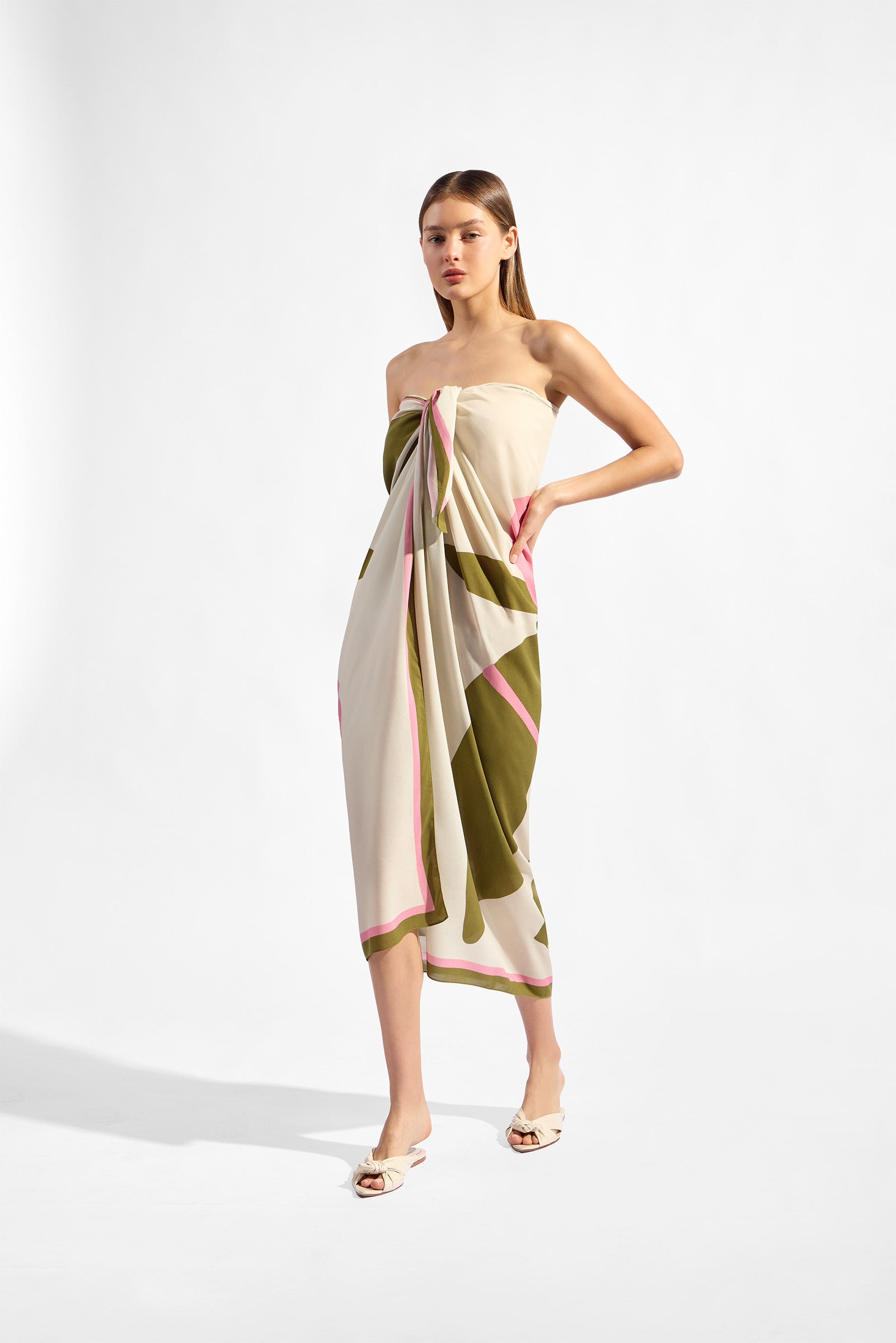 Model holding the Balearic Panneau styling, showcasing its floral green and pink print on 100% viscose fabric.