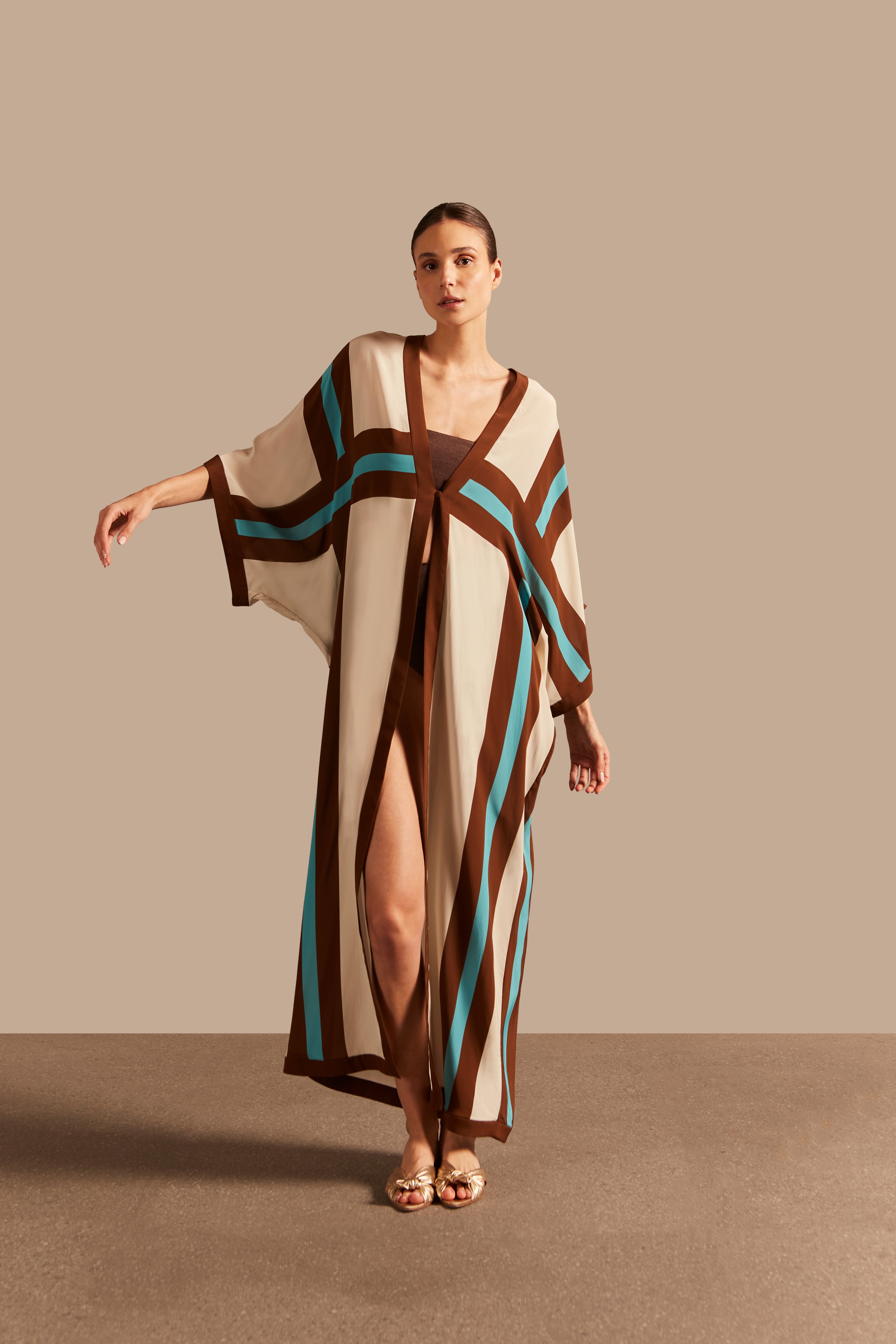 Model wearing the Bold Stripes Long Robe Front showcasing its Unique print on 100% Viscose fabric, styled for an afternoon look.