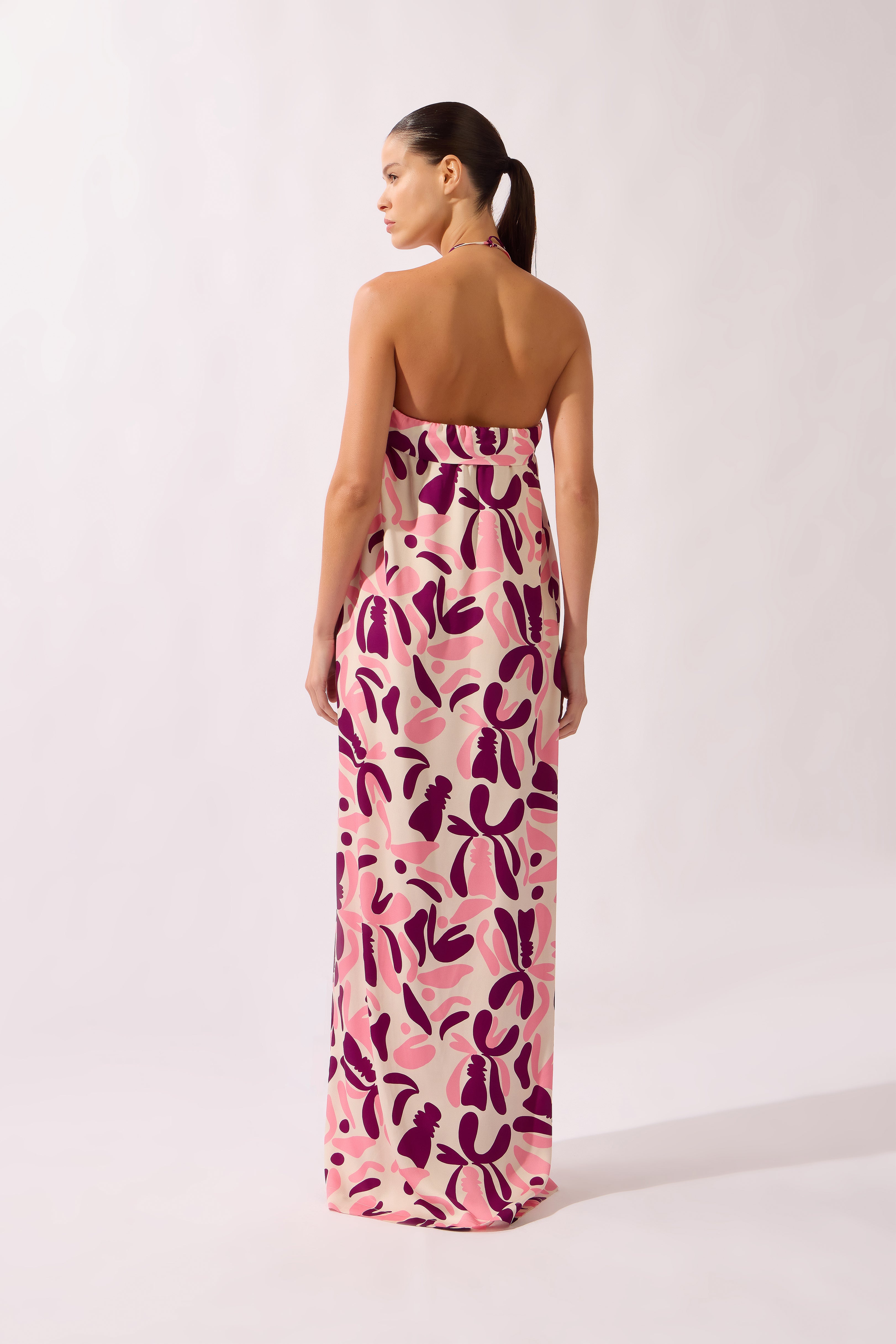 Model wearing the Bold Floral Neck-Tie Maxi Dress back unique, made from 100% viscose, styled for a beachwear look