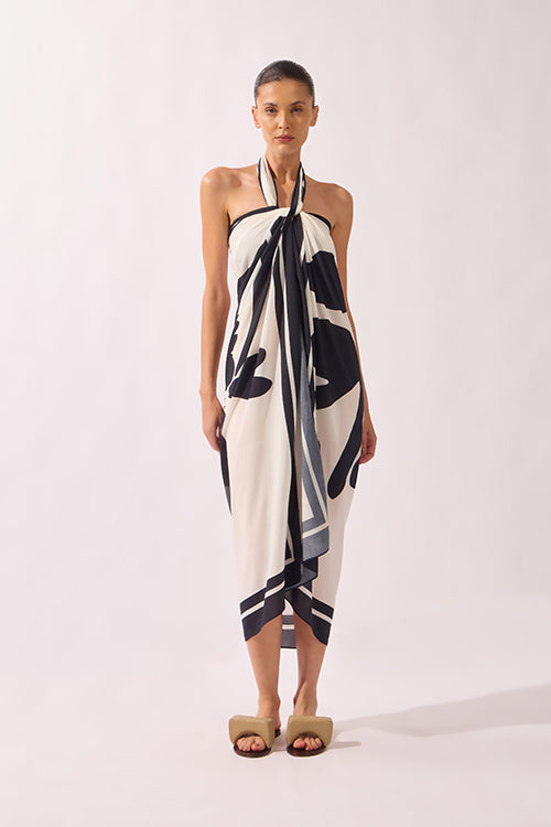 Model holding the Bold Floral Panneau look, showcasing its Bold Floral print on off-white 100% viscose fabric.