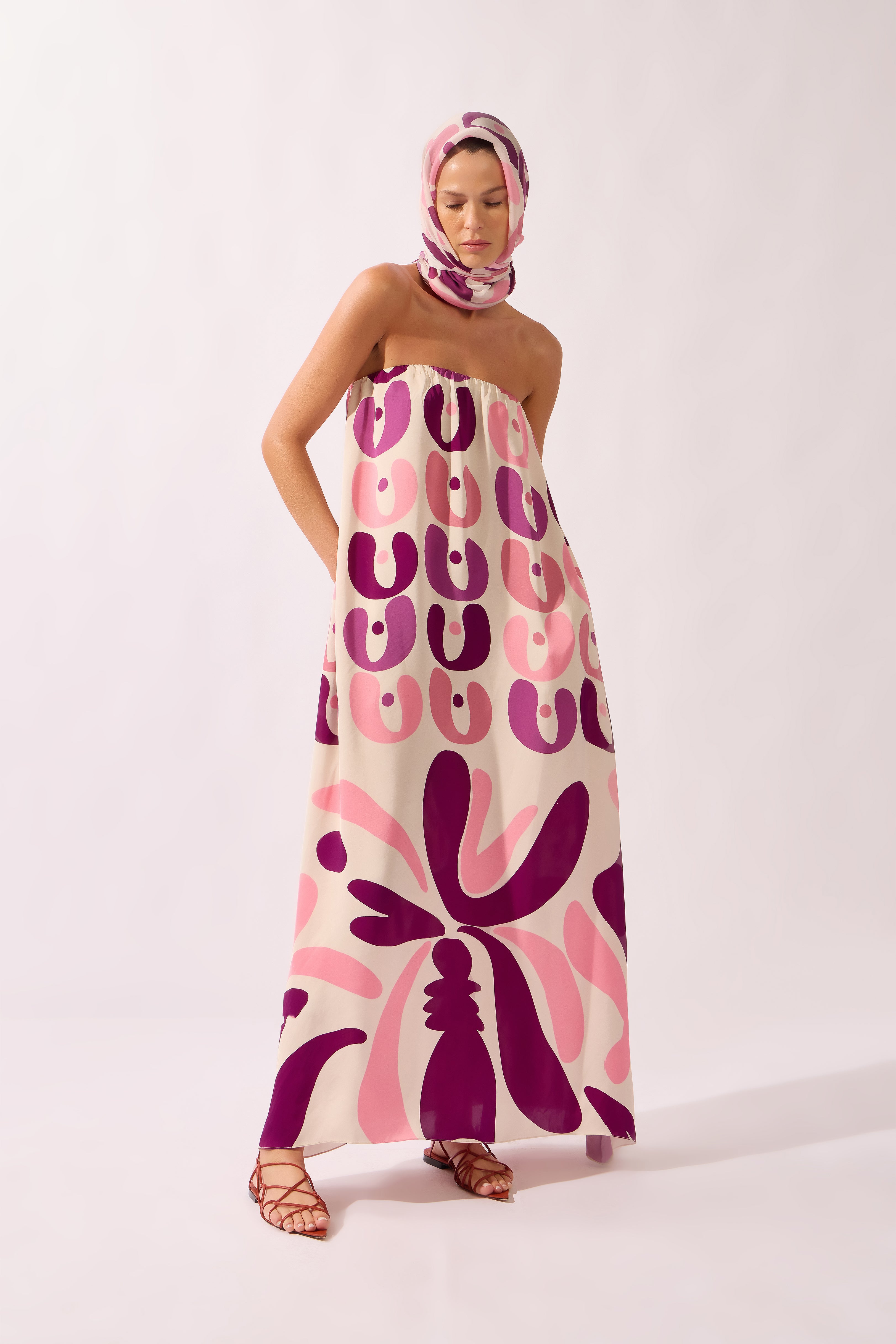 Model wearing the Bold Floral Strapless Maxi Dress look color unique, made from 100% viscose, styled for a resort look