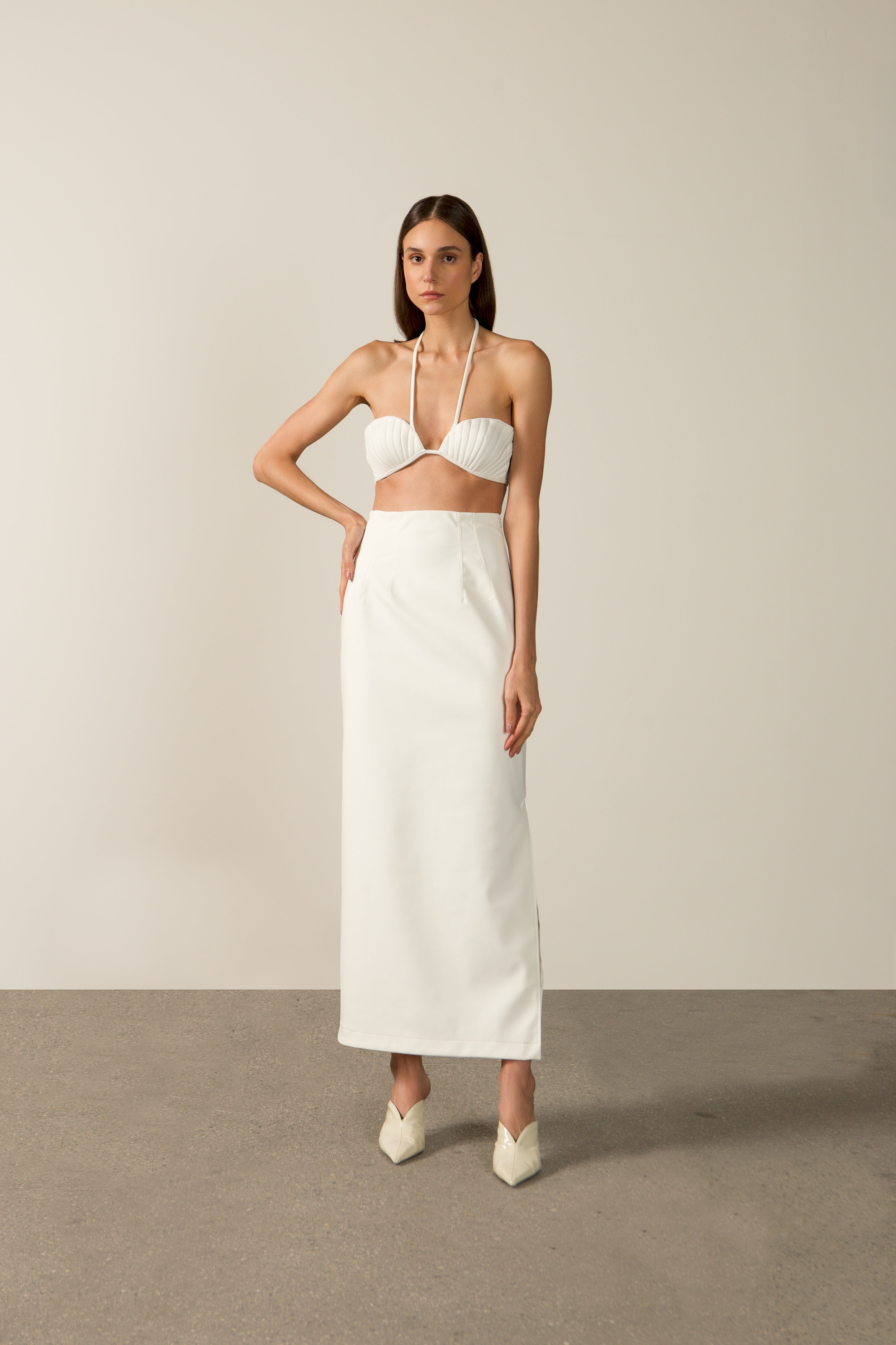 Model wearing the Coquille De Mer Long Skirt off white front from the HS25 with 76.3% Polyamide 23.7% Elastane styled for an evening look.
