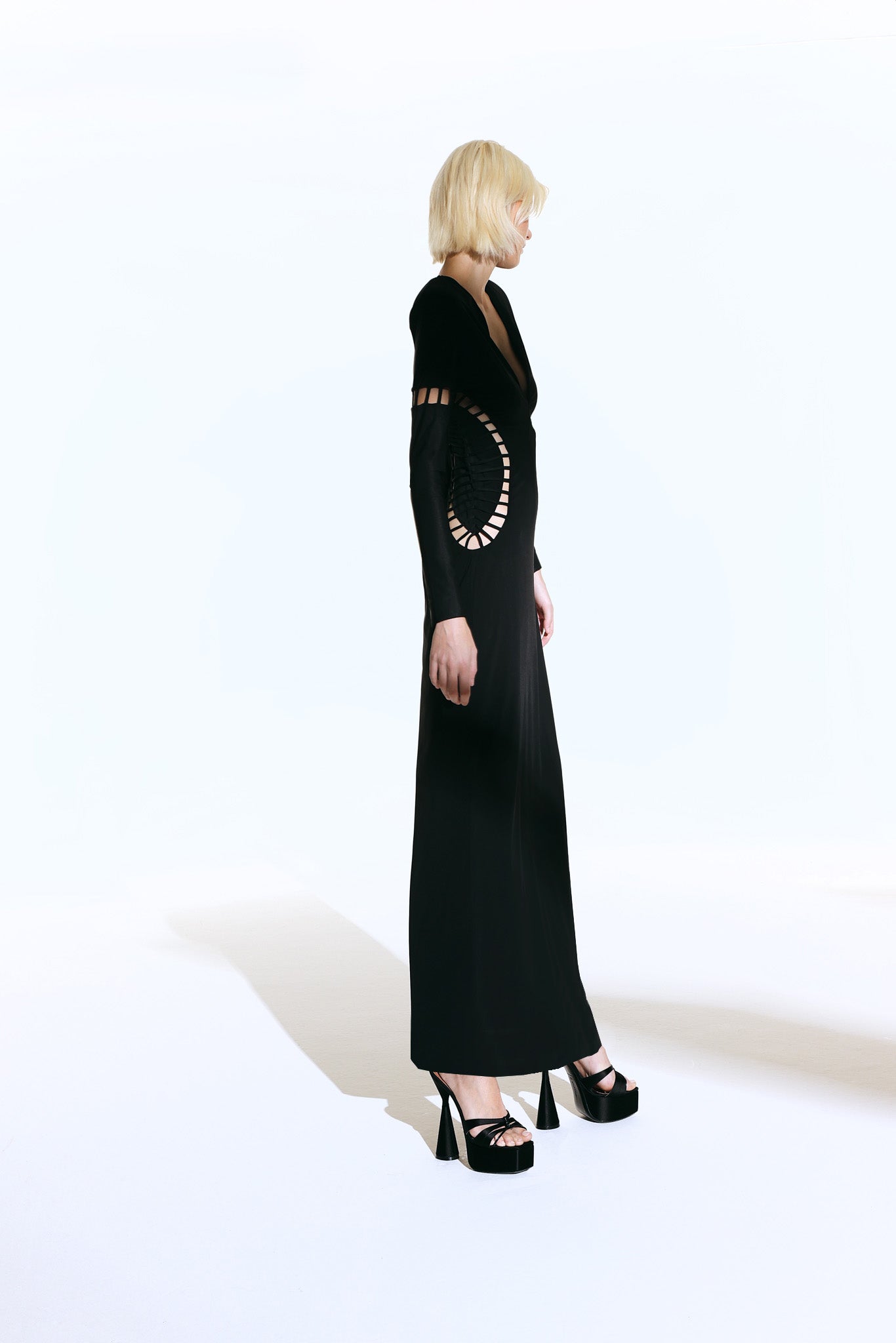 Model wearing the Cut-Out Plunge Maxi Dress concept from the Adriana Degreas and Sabine Getty collab with 75% Polyamide 25% Elastane styled for a dinner look.