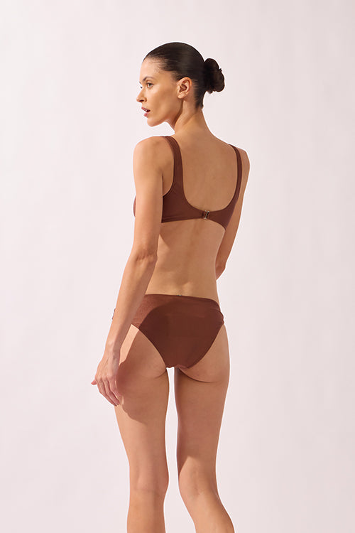 Model wearing the Geometric Straps Bikini cappuccino back from the HS25 with 85% Polyamide 15% Elastane styled for a beach look.