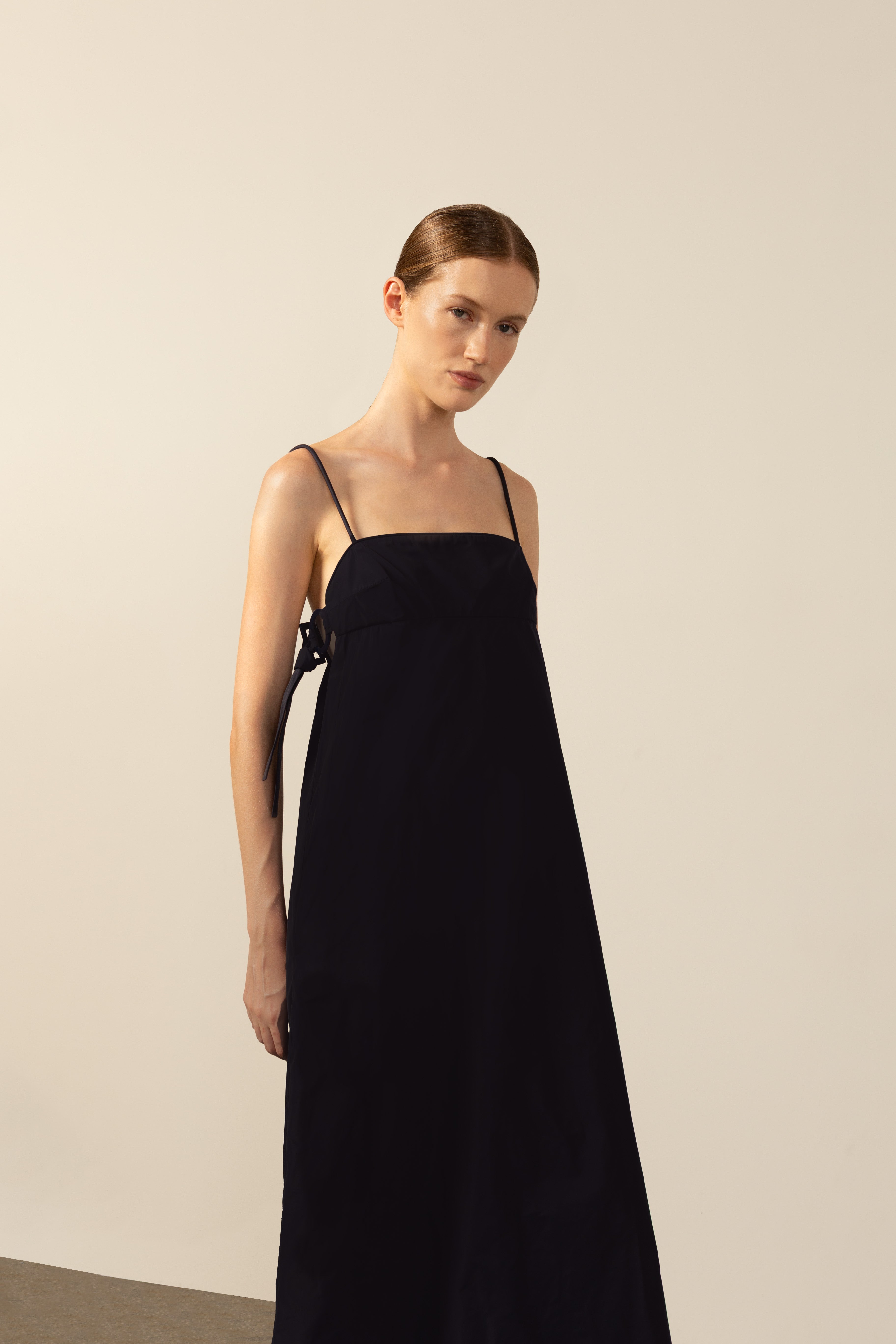 Model wearing the Geometric Straps Long Dress navy front from the HS25 with 100% polyester styled for a beach look.