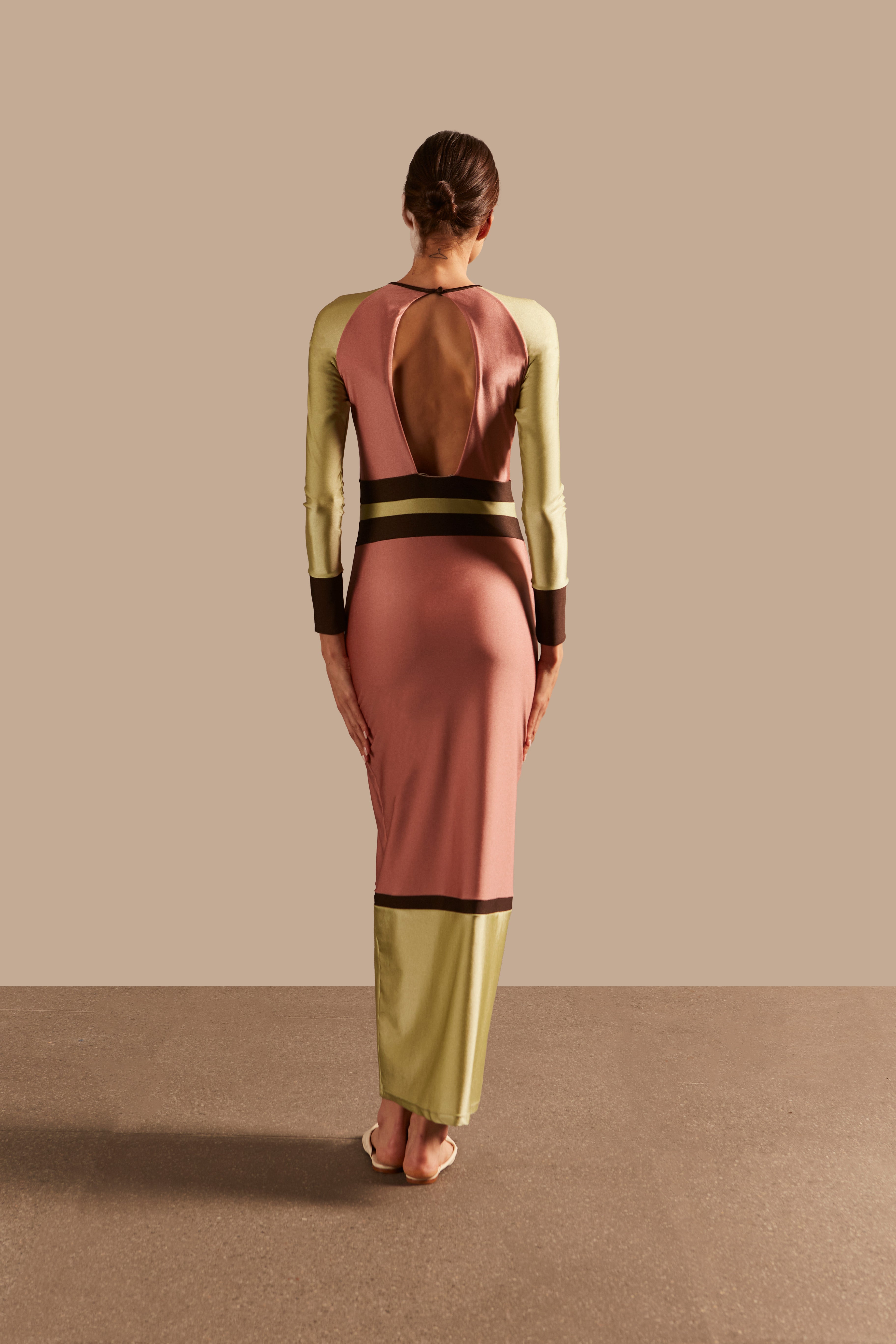 Model wearing the Giardino Long Dress Back showcasing its Pink/Coffee/Green Olive color on 85% Polyamide 15% Elastane fabric, styled for an afternoon look.