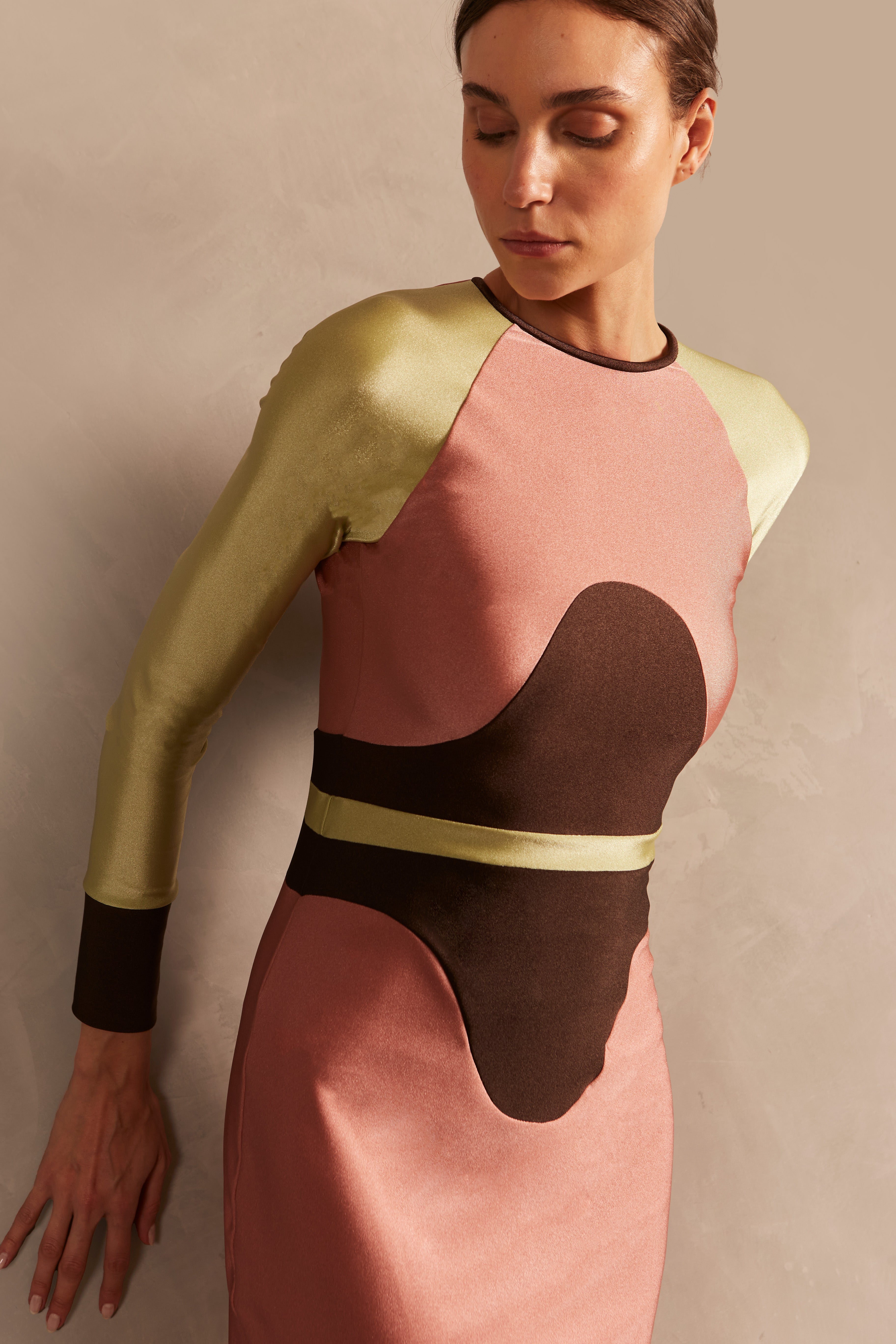 Model wearing the Giardino Long Dress Detail showcasing its Pink/Coffee/Green Olive color on 85% Polyamide 15% Elastane fabric, styled for an afternoon look.