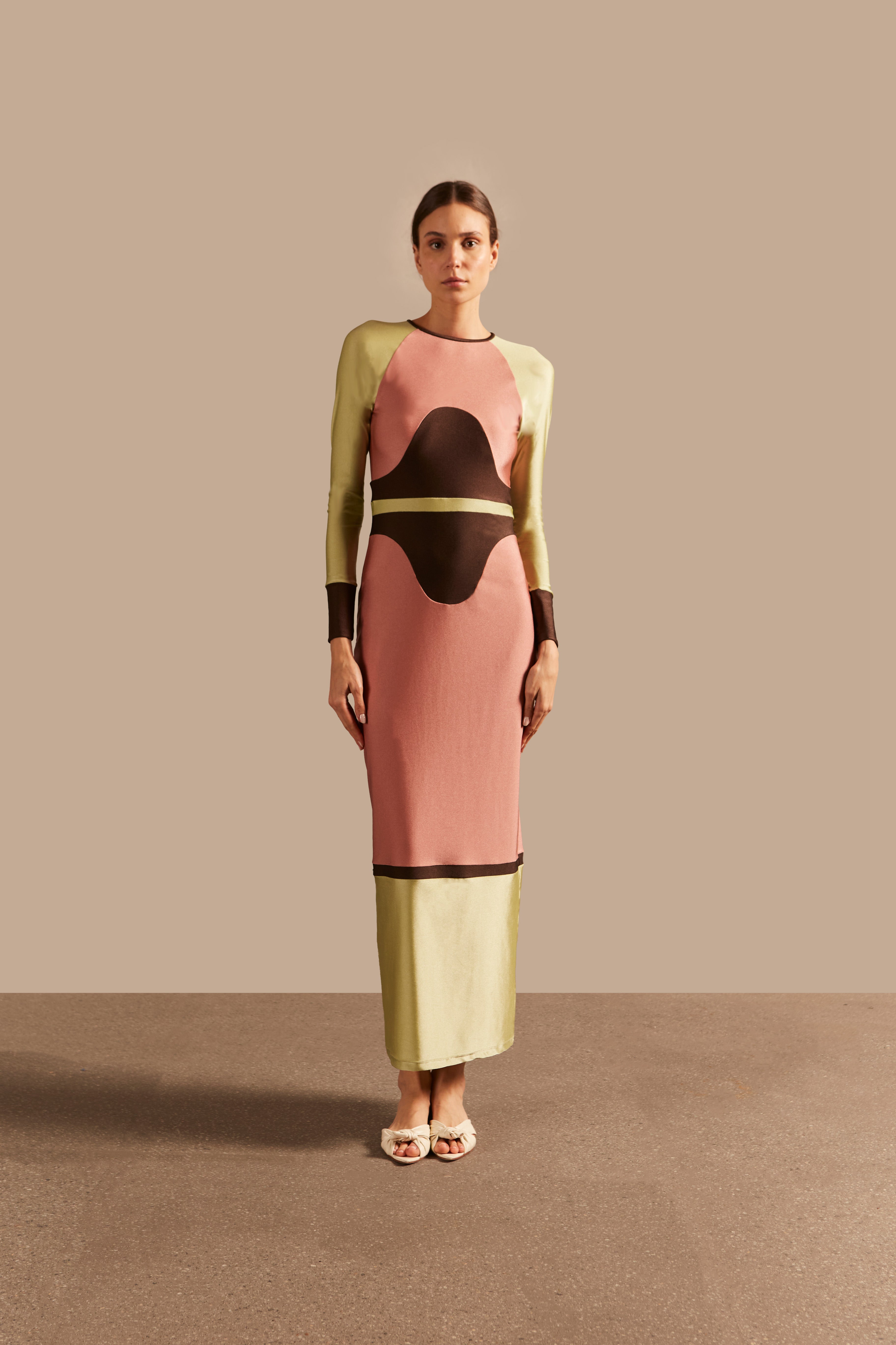 Model wearing the Giardino Long Dress Front showcasing its Pink/Coffee/Green Olive color on 85% Polyamide 15% Elastane fabric, styled for an afternoon look.