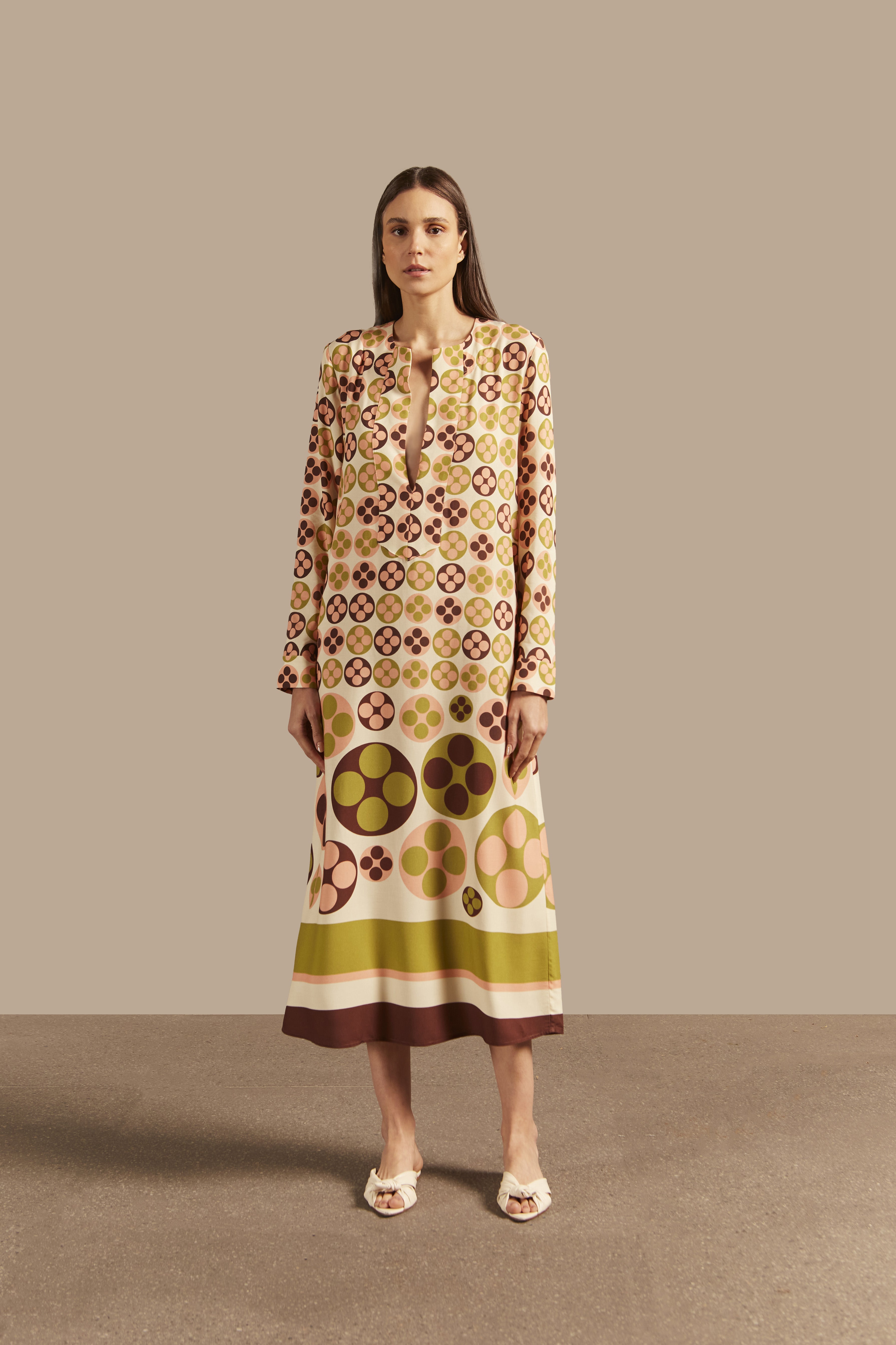Model wearing the Giardino Long Tunic Front showcasing its Unique color on 100% Viscose  fabric, styled for an afternoon look.