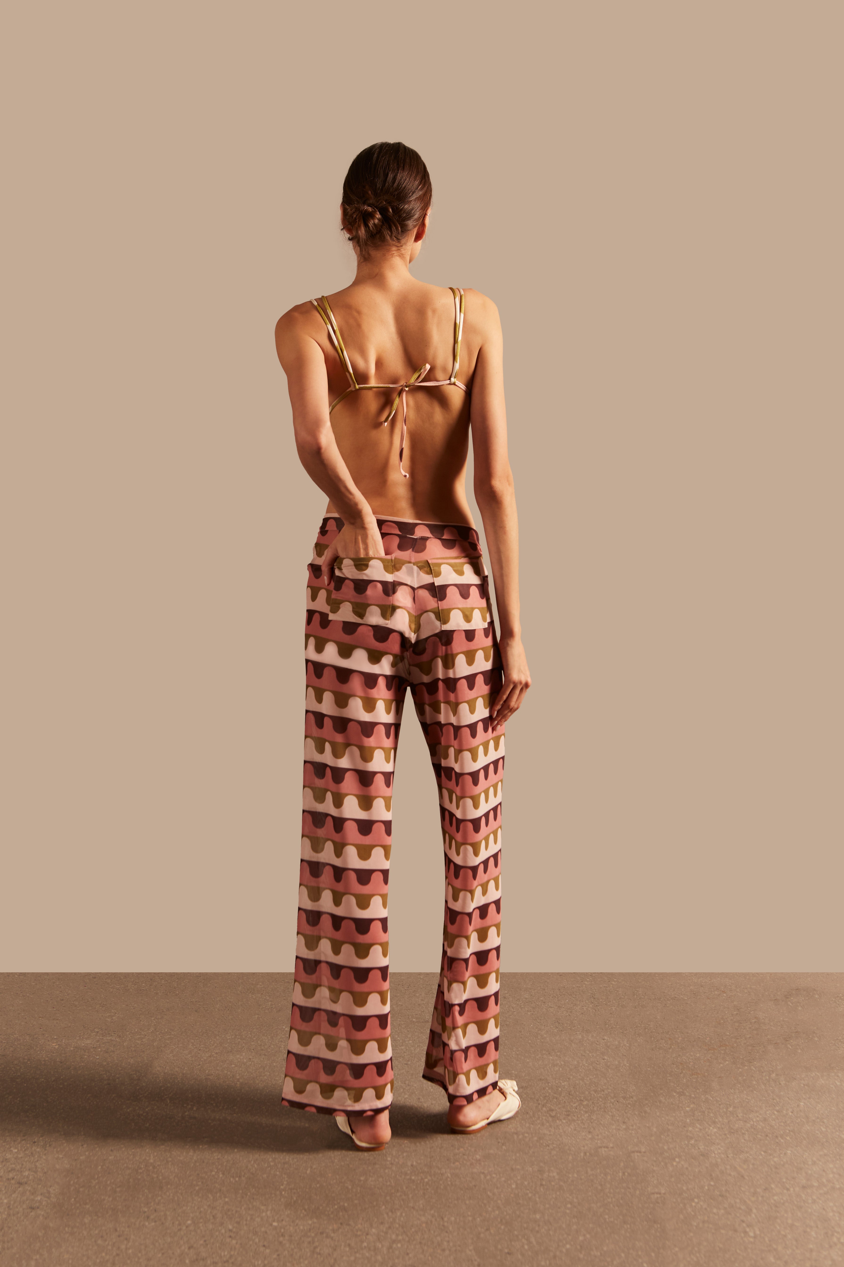 Model wearing the Giardino Straight Pants Shirt Back showcasing its Unique color on 96% Polyester 4% Elastane fabric, styled for an resort look.