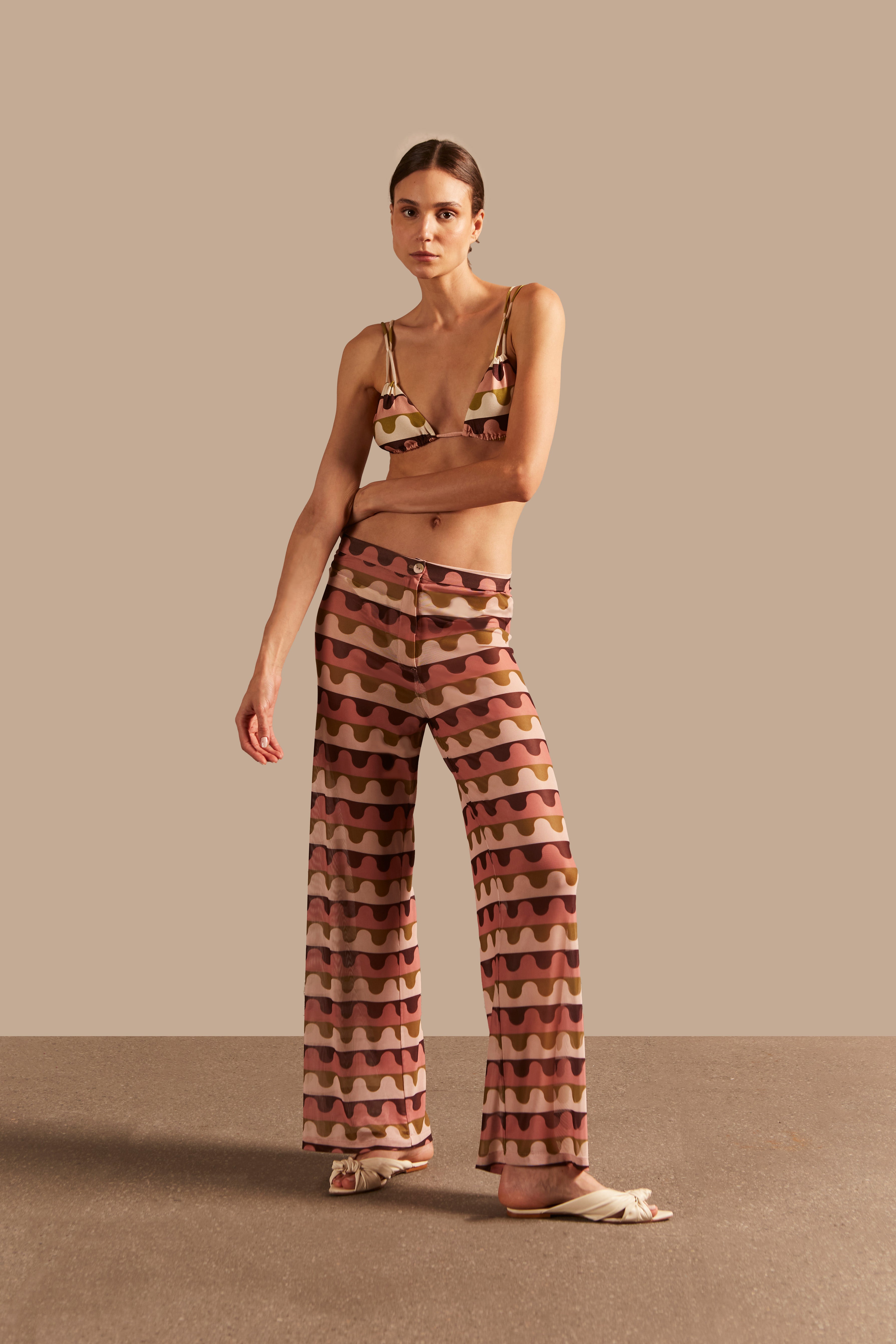 Model wearing the Giardino Straight Pants Shirt Concept showcasing its Unique color on 96% Polyester 4% Elastane fabric, styled for an resort look.