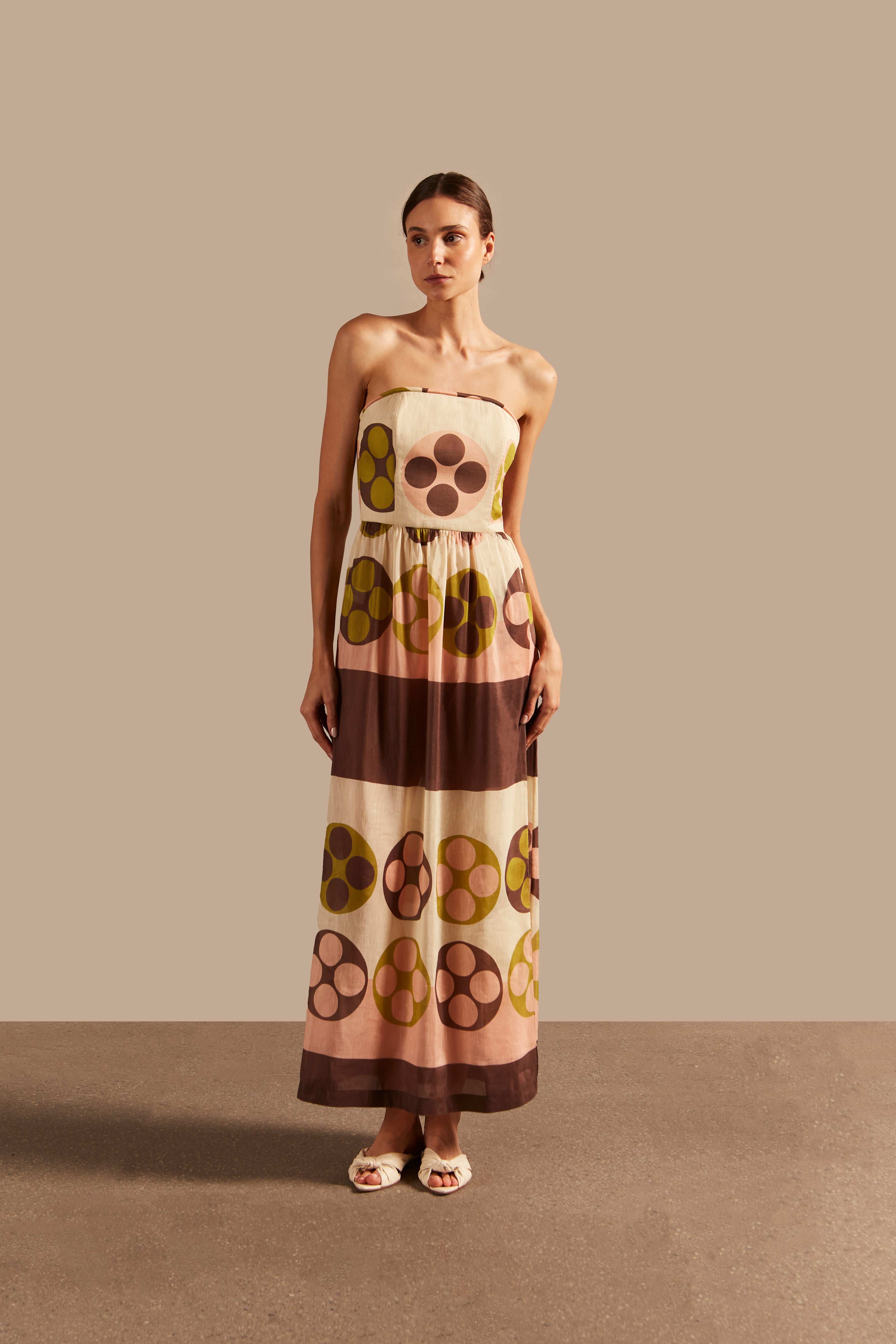 Model wearing the Giardino Strapless Long Dress Front showcasing its Unique color on 64% Linen 36% Silk fabric, styled for an afternoon look.