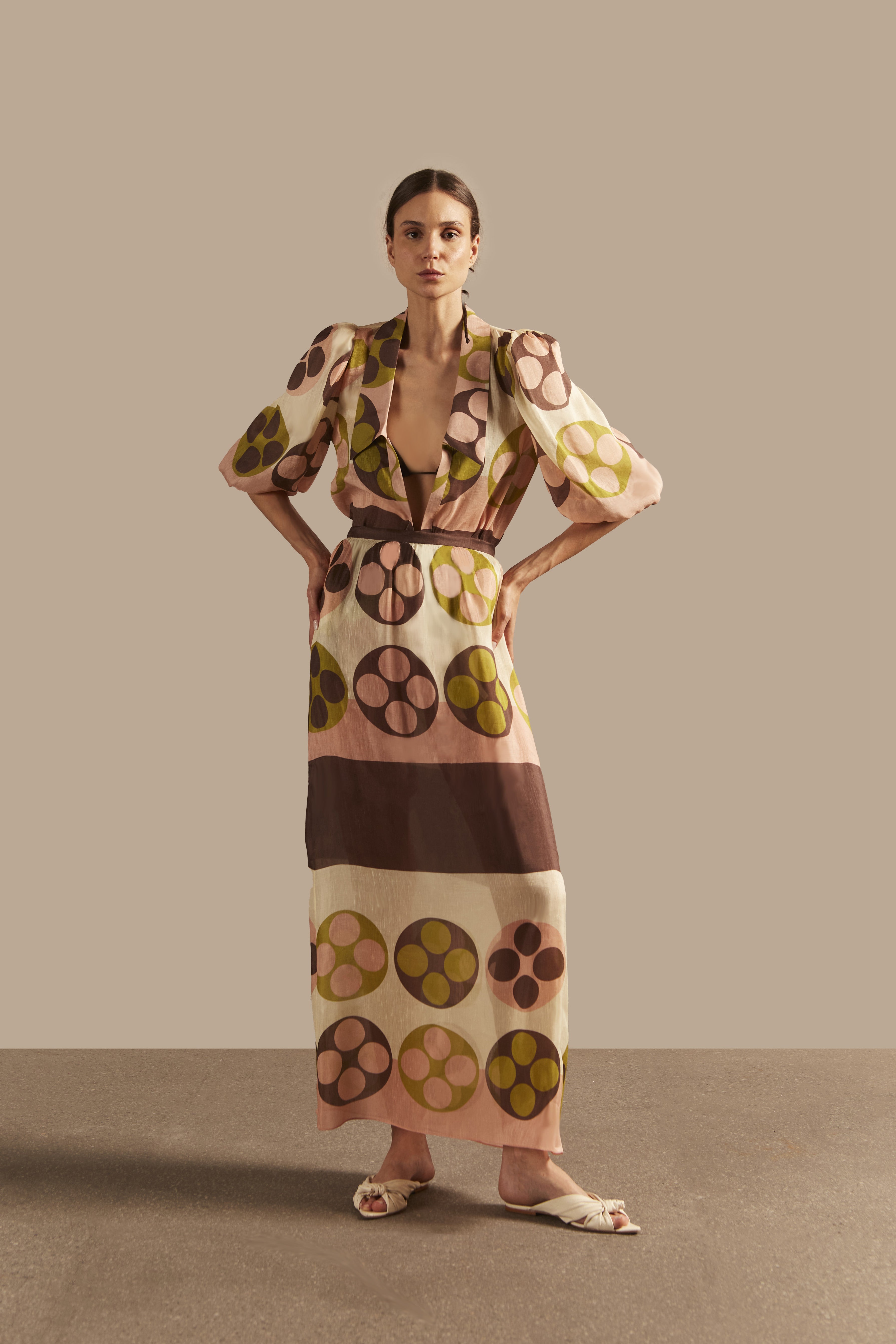 Model wearing the Giardino Long Skirt Front showcasing its Unique color on 64% Linen 36% Silk fabric, styled for an afternoon look.