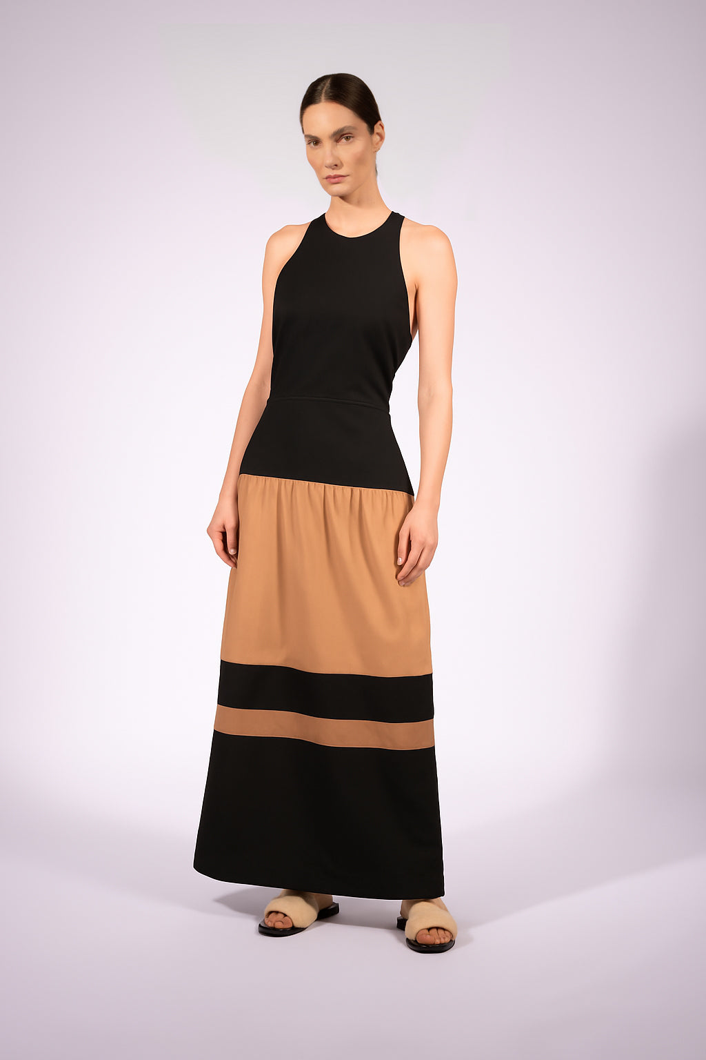 Model wearing the Halterneck Maxi Dress front made from 100% viscose, styled for a resort look.