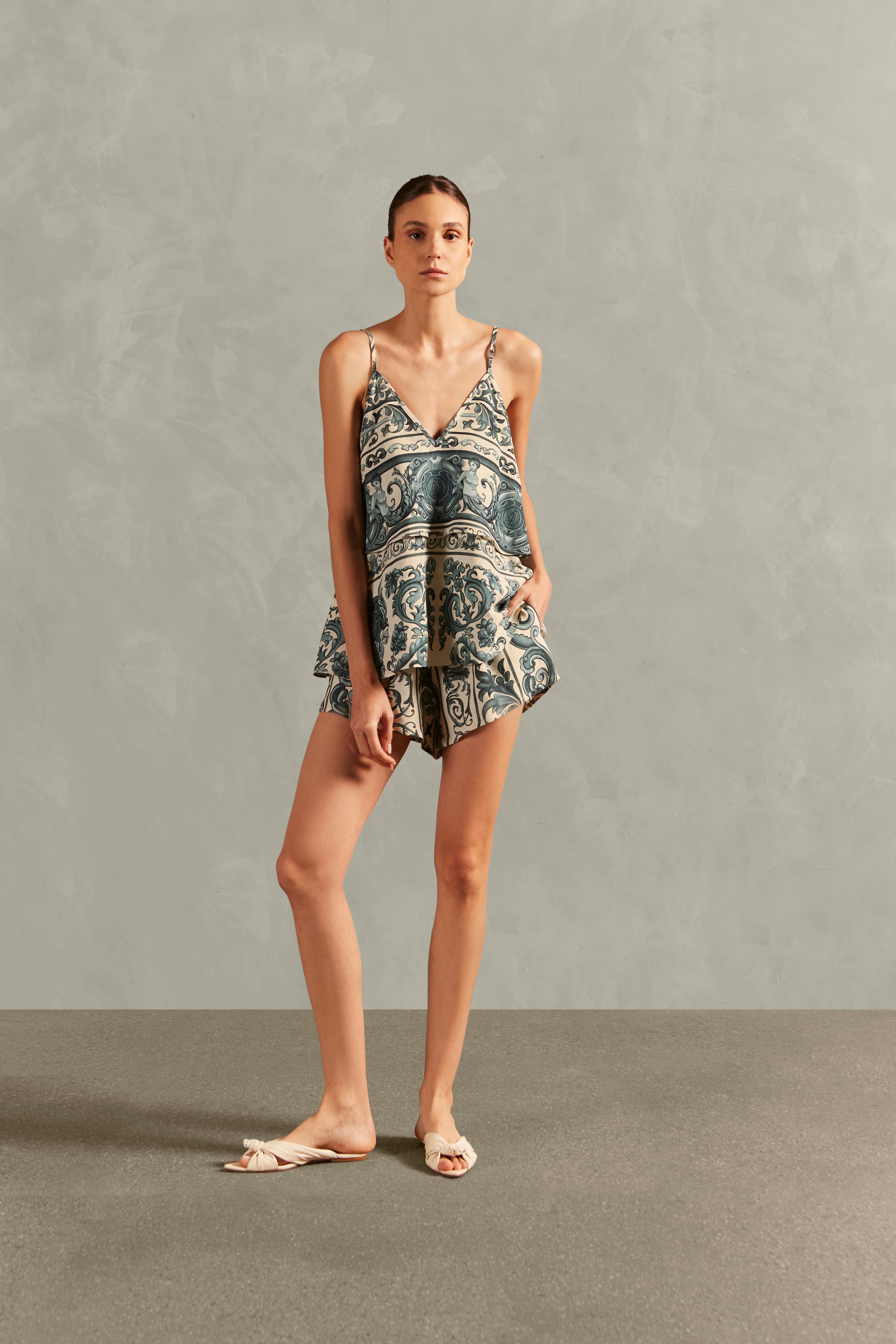 Model wearing the Hera Blouse With Straps Front showcasing its BLUE color on 56% Viscose 24% Linen 20% Silk fabric, styled for a resort look.