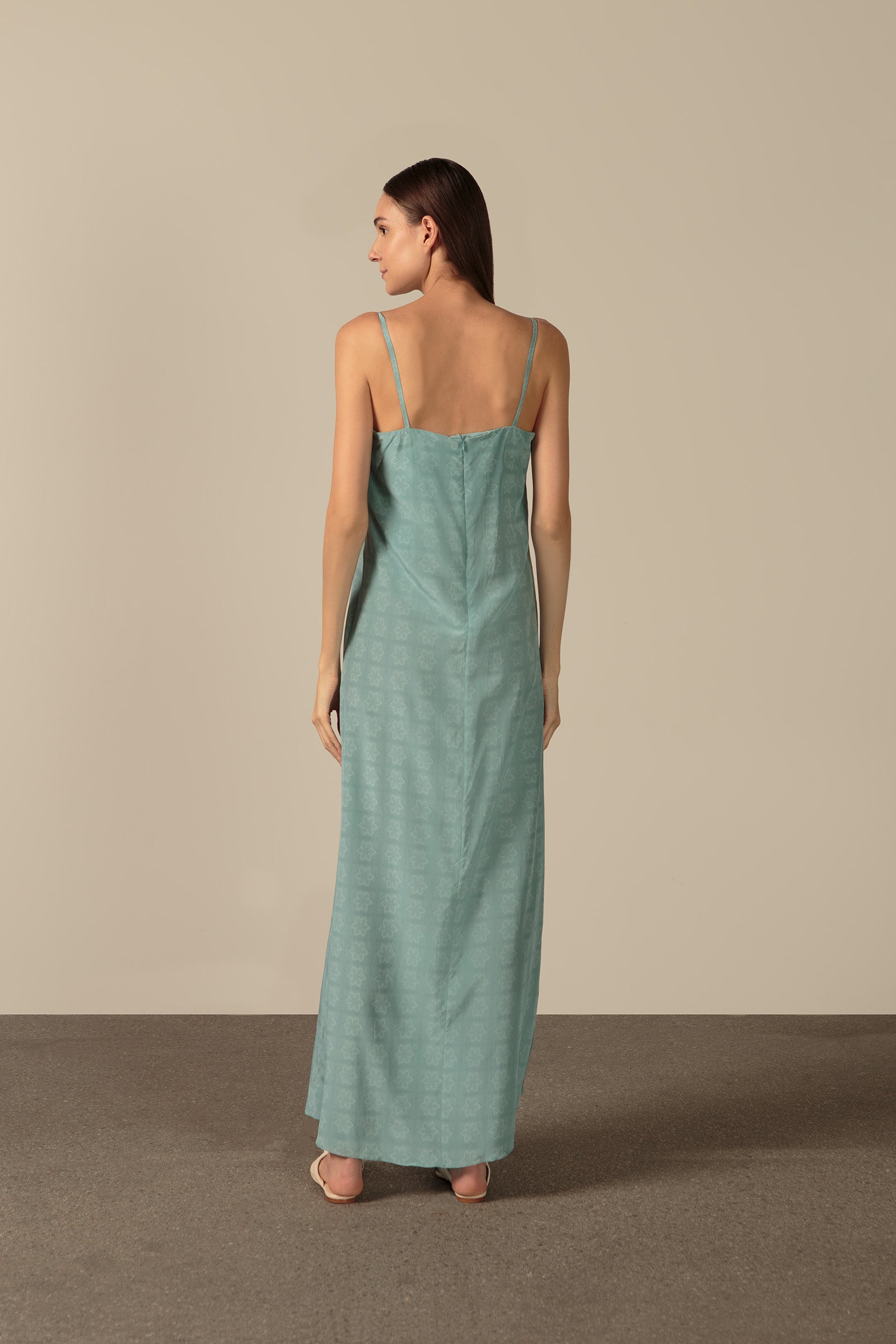 Model wearing the Hera Deep-V Long Dress Back showcasing its Blue color on 100% Silk fabric.