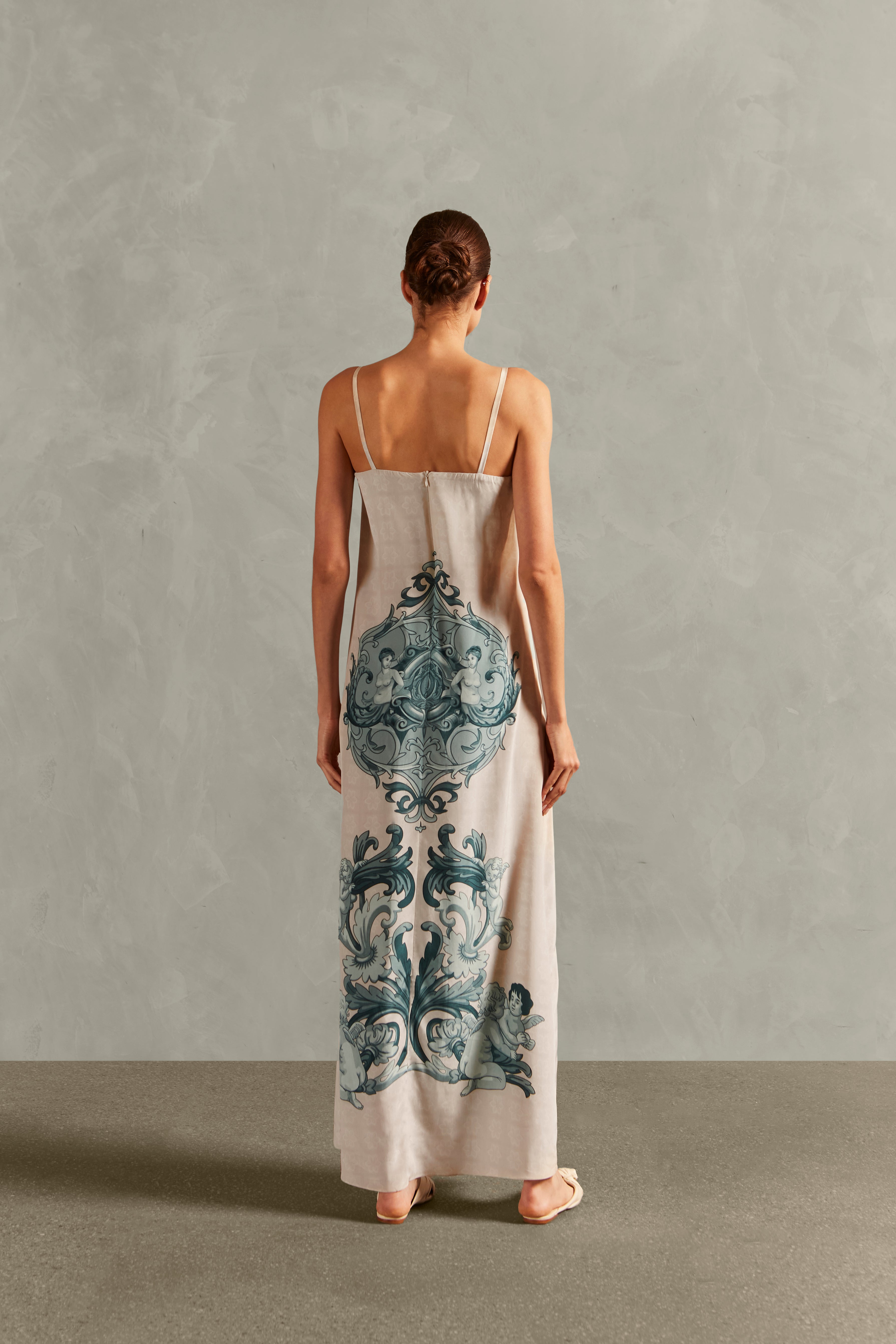 Model wearing the Hera Deep-V Long Dress Back showcasing its Off White color on 100% Silk fabric.