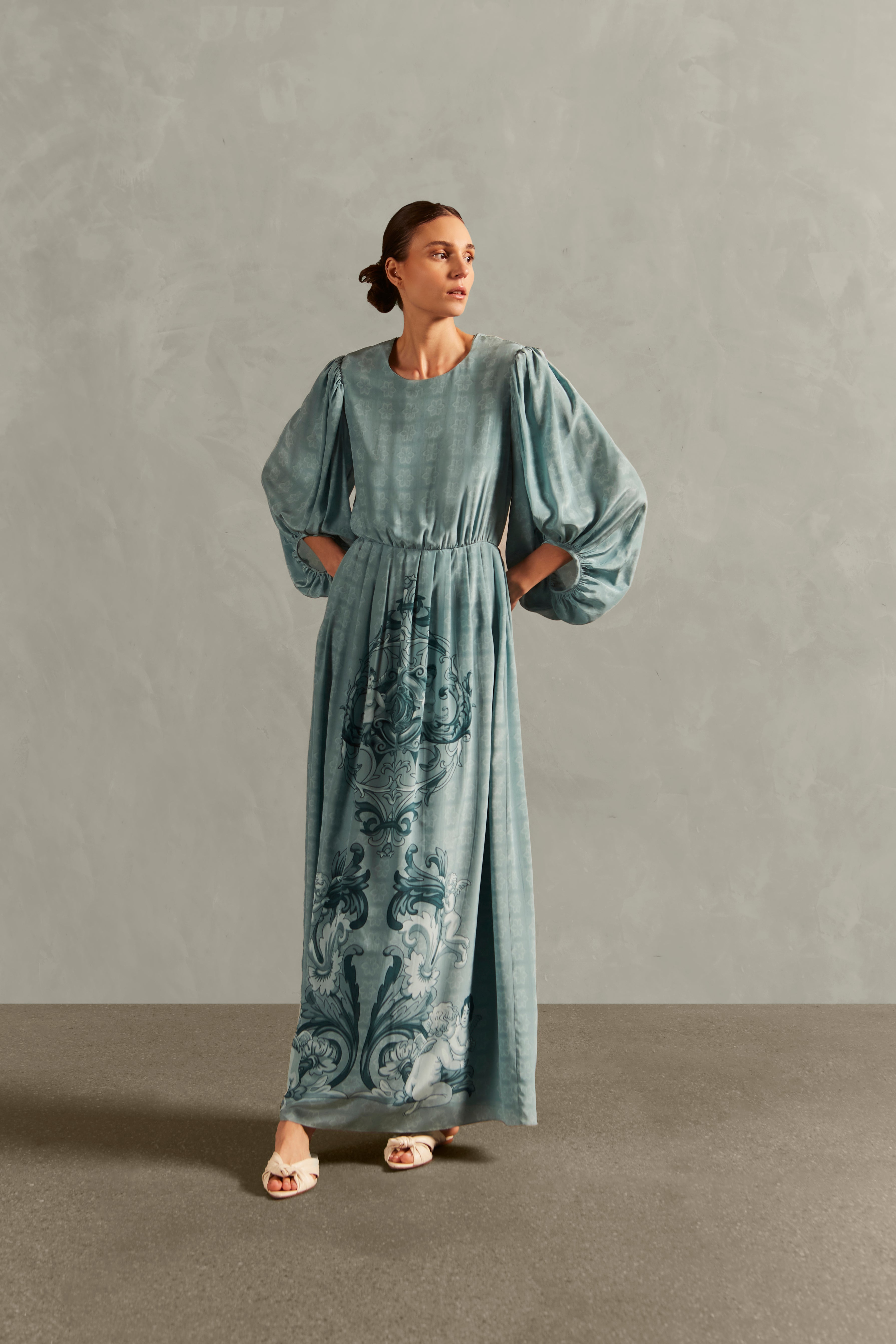 Model wearing the Hera Puff-Sleeved Long Dress Front showcasing its Blue color on 100% Silk fabric.