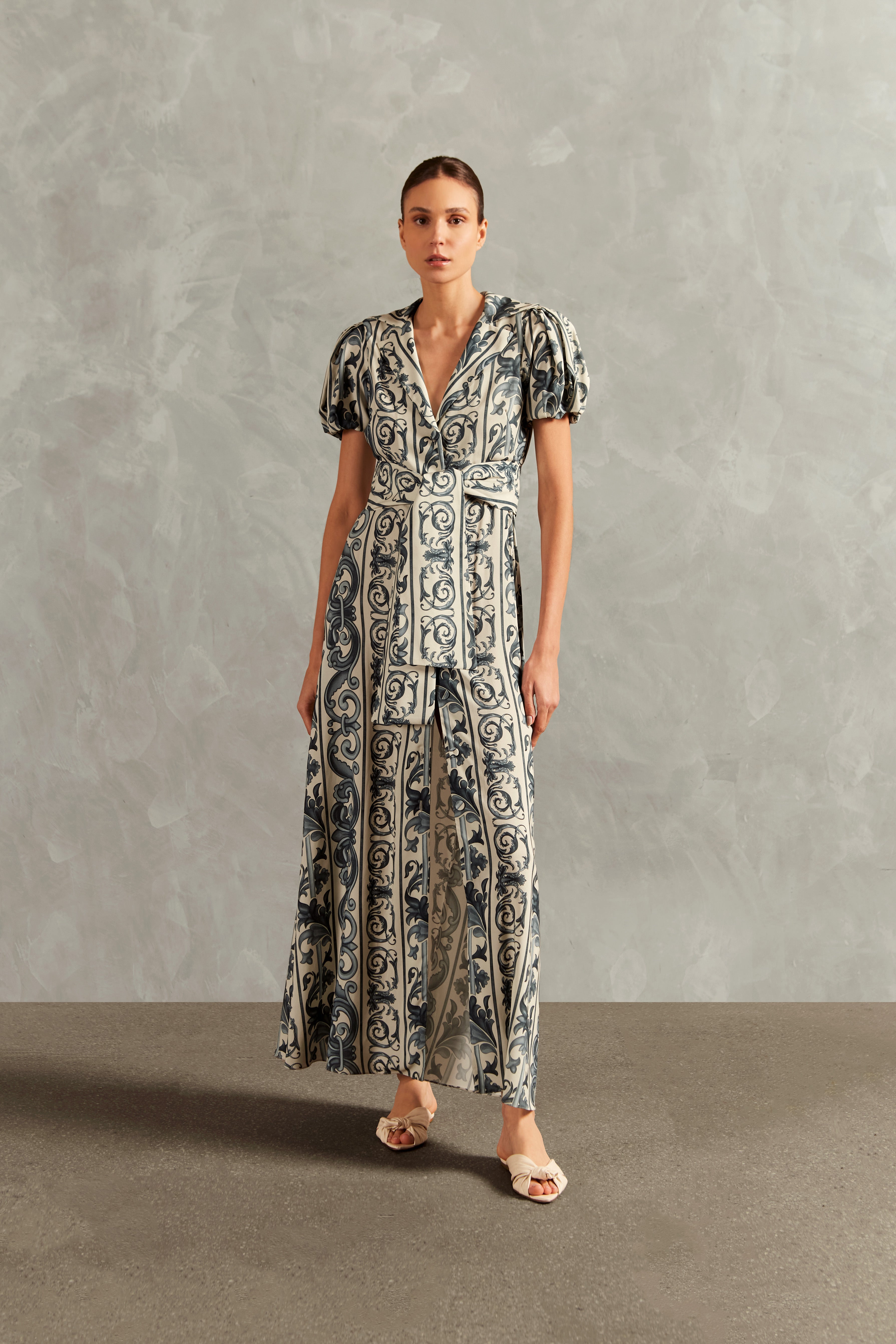 Model wearing the Hera Puff-Sleeved Long Dress Front showcasing its BLUE color on 100% Viscose fabric, styled for a resort look.