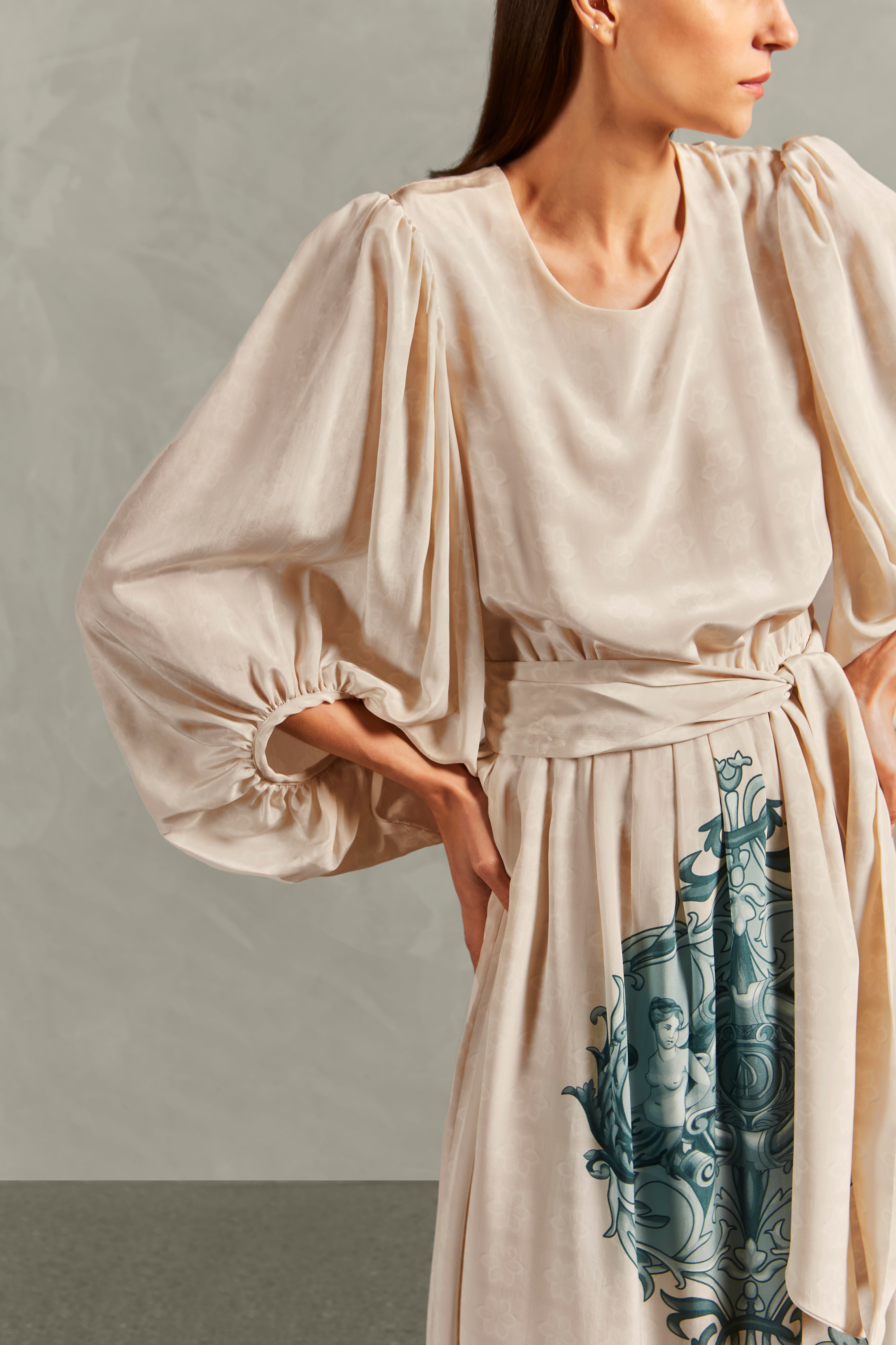 Model wearing the Hera Puff-Sleeved Long Dress Detail showcasing its Off White color on 100% Silk fabric.