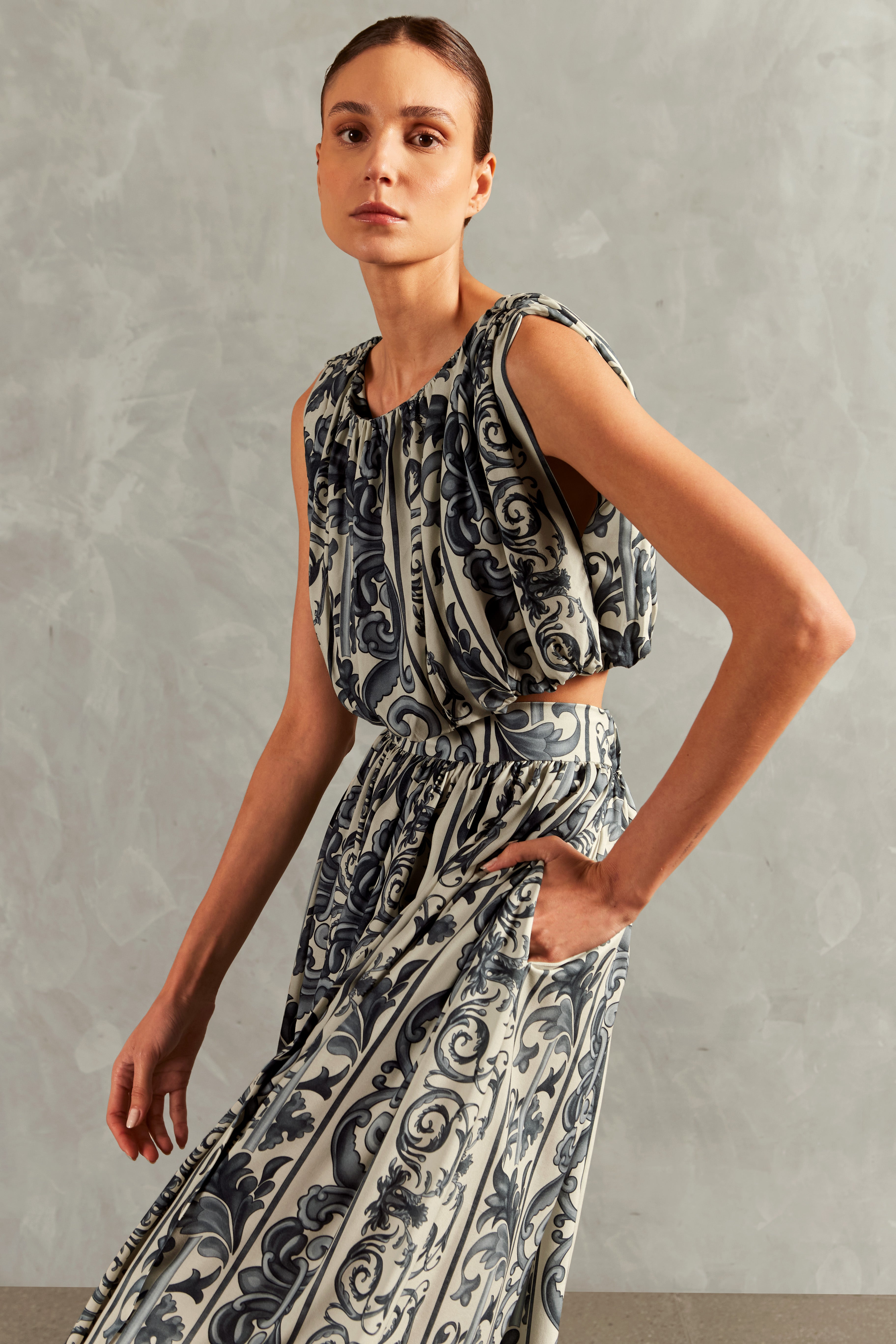 Model wearing the Hera Side-Slit Long Skirt Front showcasing its BLUE color on 100% Viscose fabric.