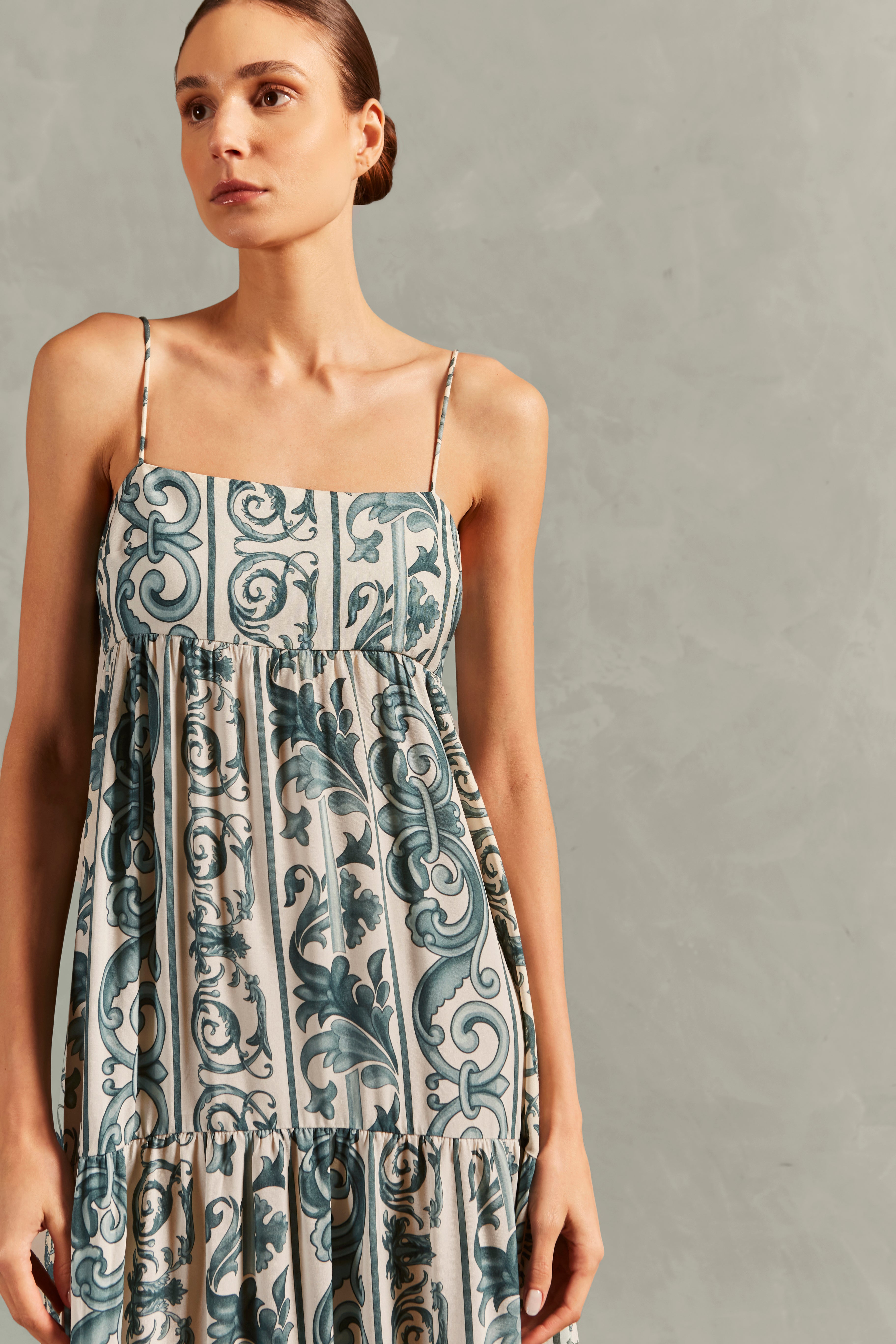 Model wearing the Hera Straps Long Dress Detail showcasing its BLUE color on 100% Viscose fabric.