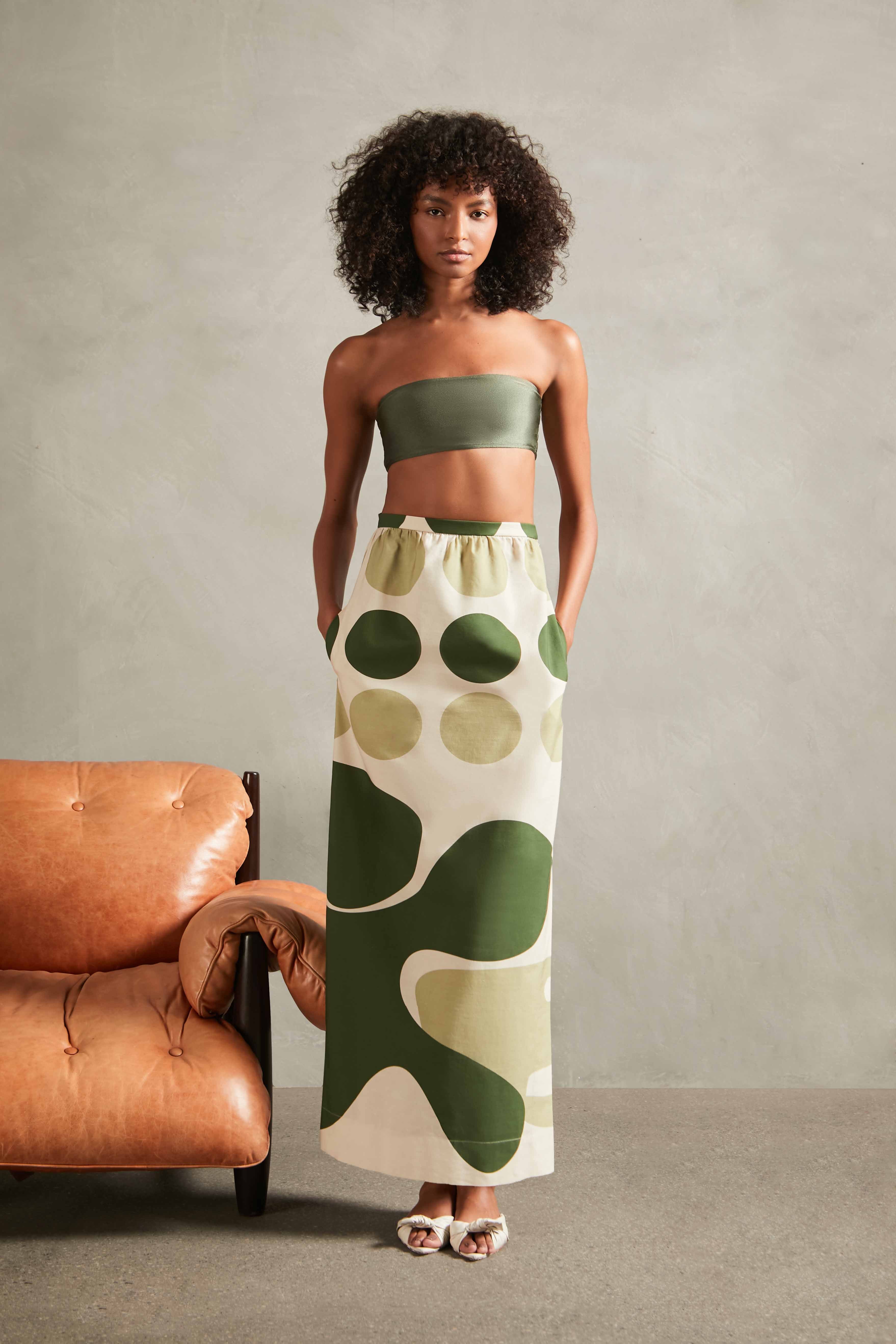 Model wearing the Jellyfish Long Skirt Front with bikini top with unique Print on 97% Polyester 3% Elastane, styled for a resort look.