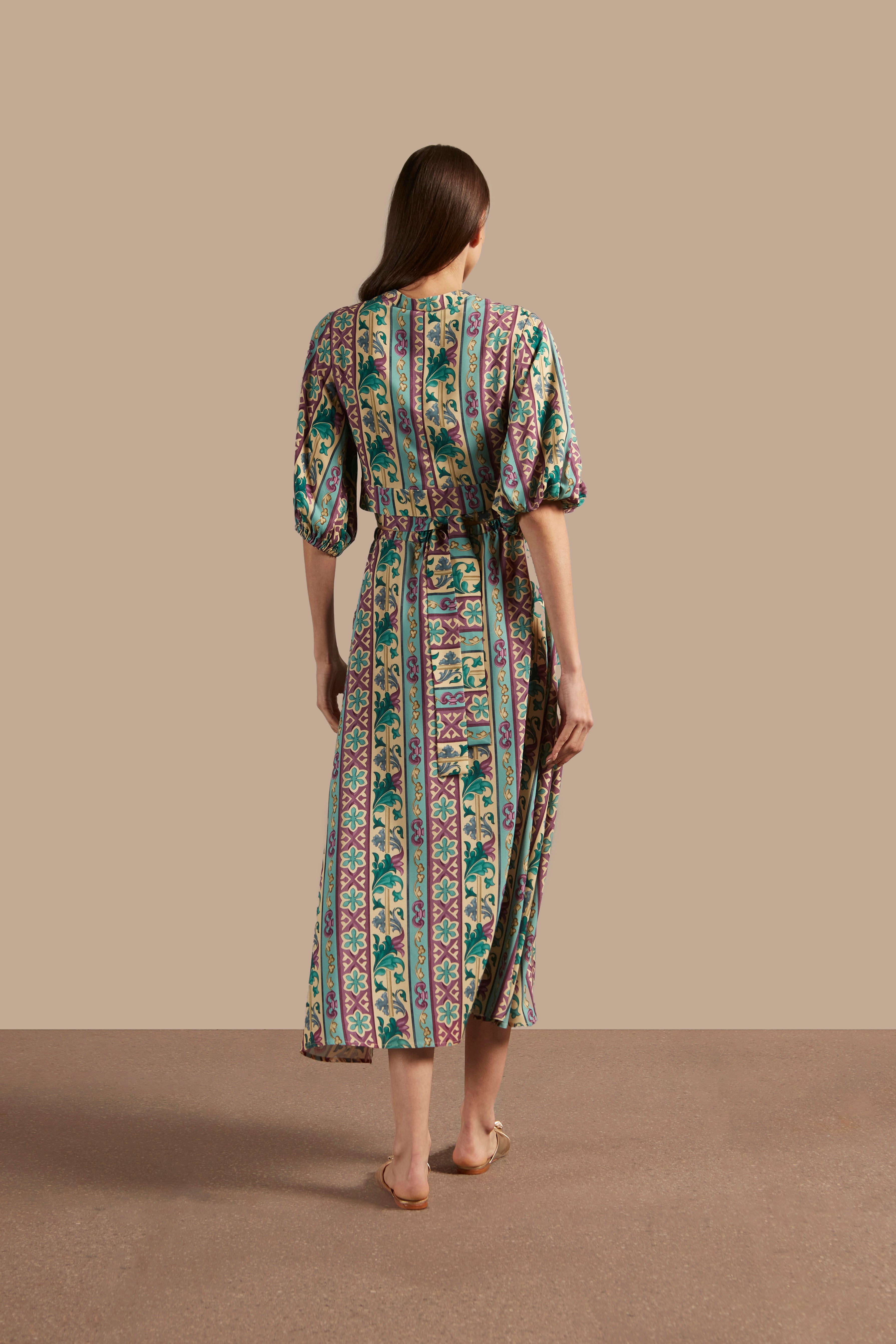 Model wearing the Le Sirenuse Long Skirt Back showcasing its Blue color on 100% Viscose fabric, styled for an afternoon look.