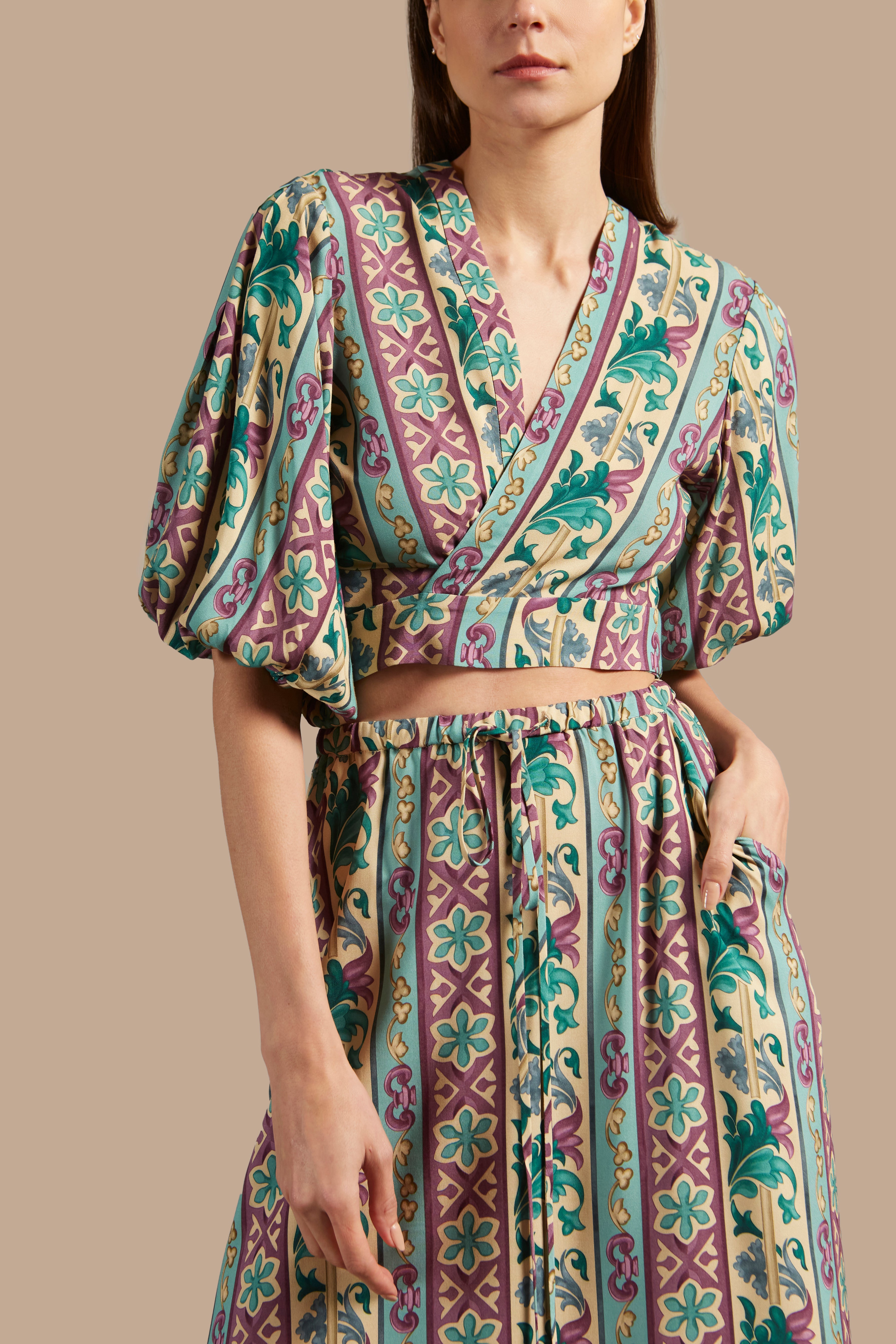 Model wearing the Le Sirenuse Long Skirt Detail showcasing its Blue color on 100% Viscose fabric, styled for an afternoon look.