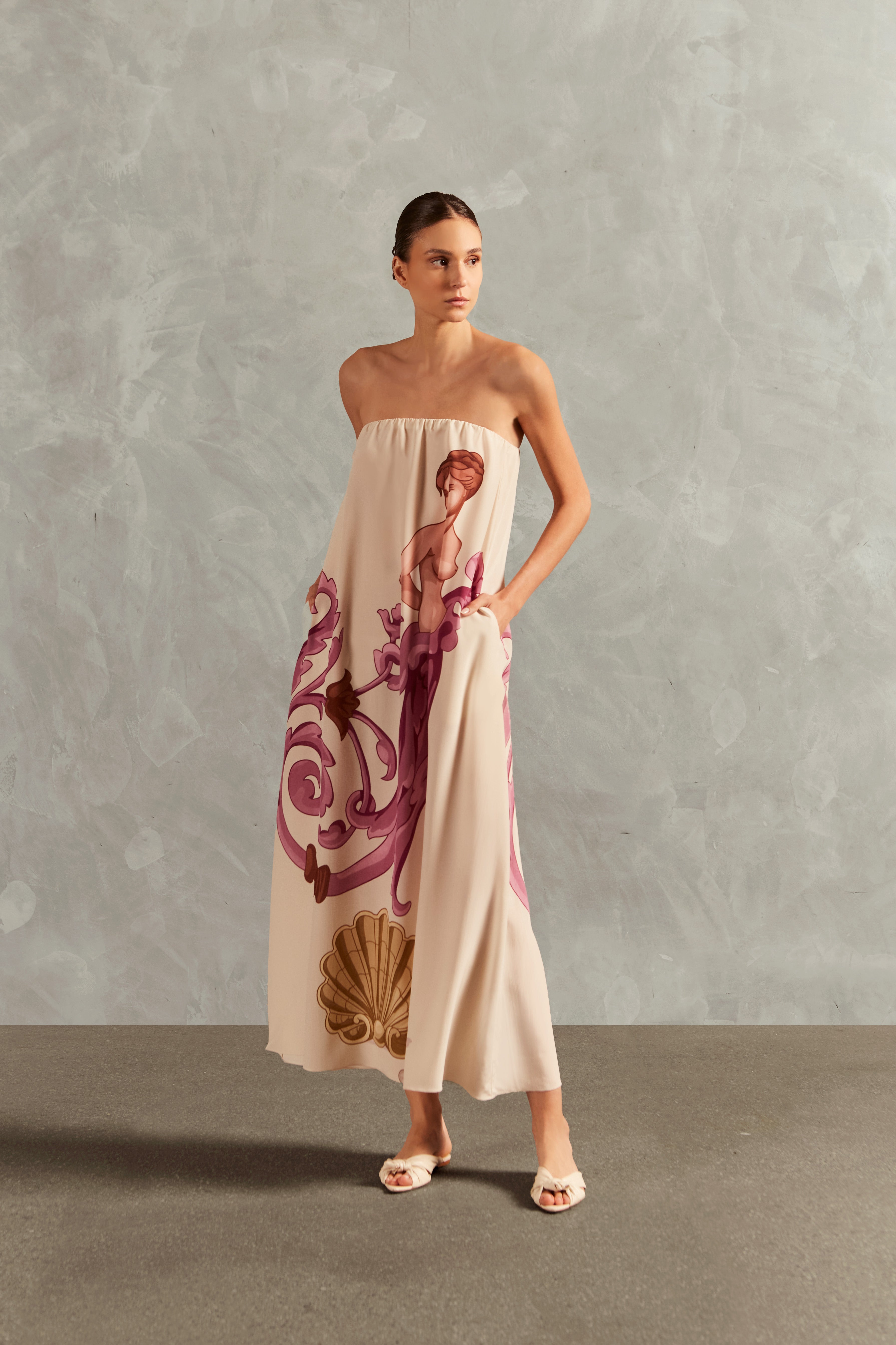 Model wearing the Le Sirenuse Strapless Long Dress Front showcasing its Lilac color on 100% Silk fabric, styled for an afternoon look.