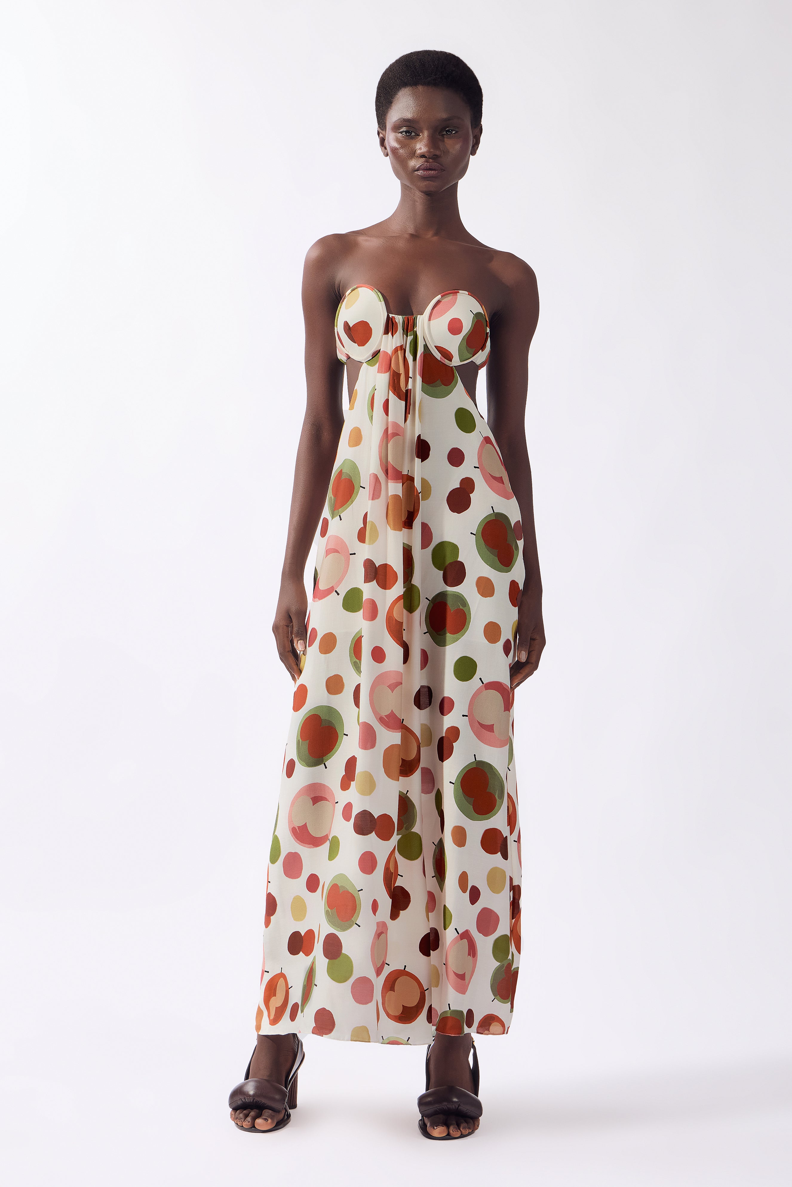 Model wearing the Lina Off-The-Shoulder Maxi Dress Front color unique, made from 80% viscose 20% silk, styled for a dinner look