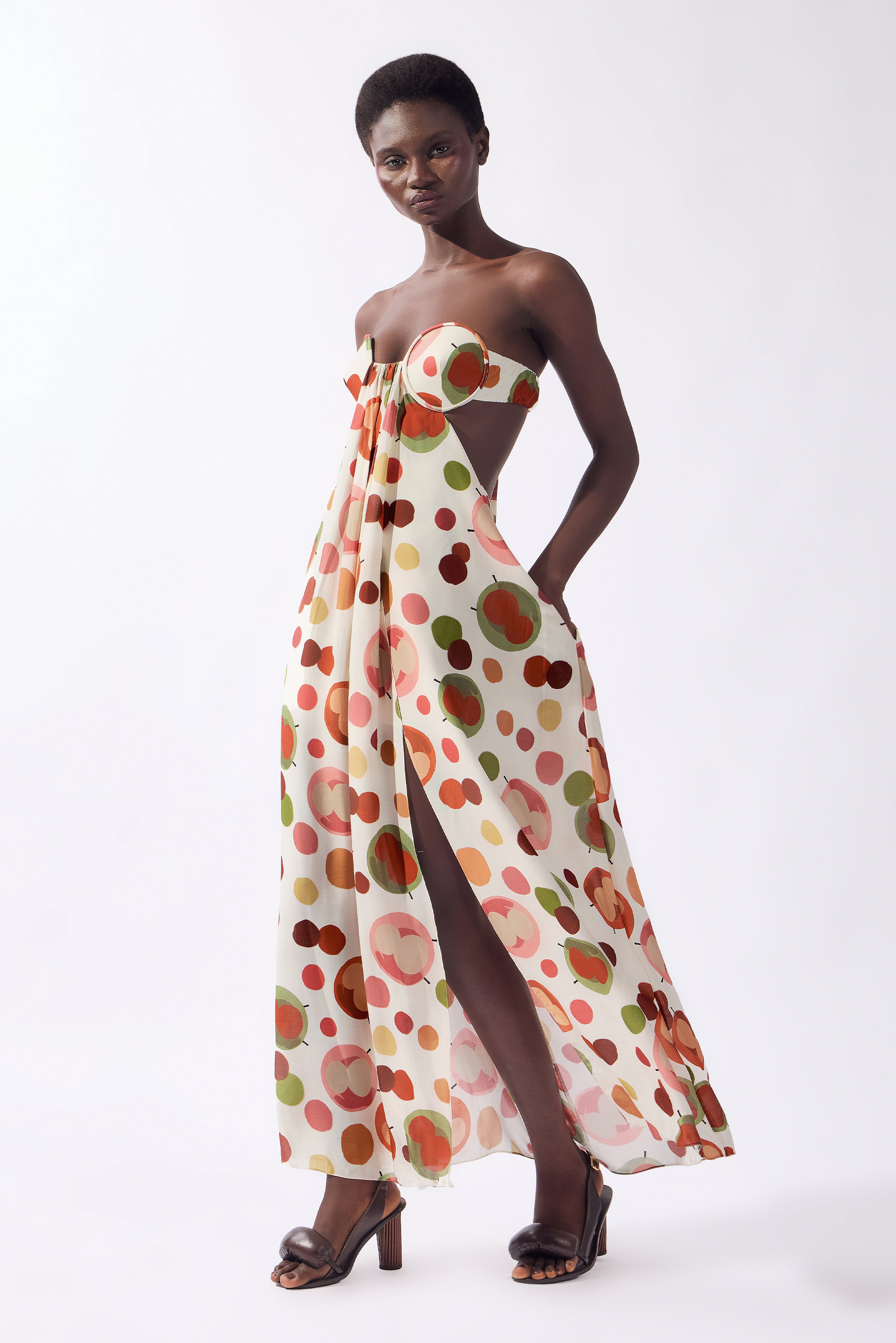 Model wearing the Lina Off-The-Shoulder Maxi Dress look color unique, made from 80% viscose 20% silk, styled for a dinner look