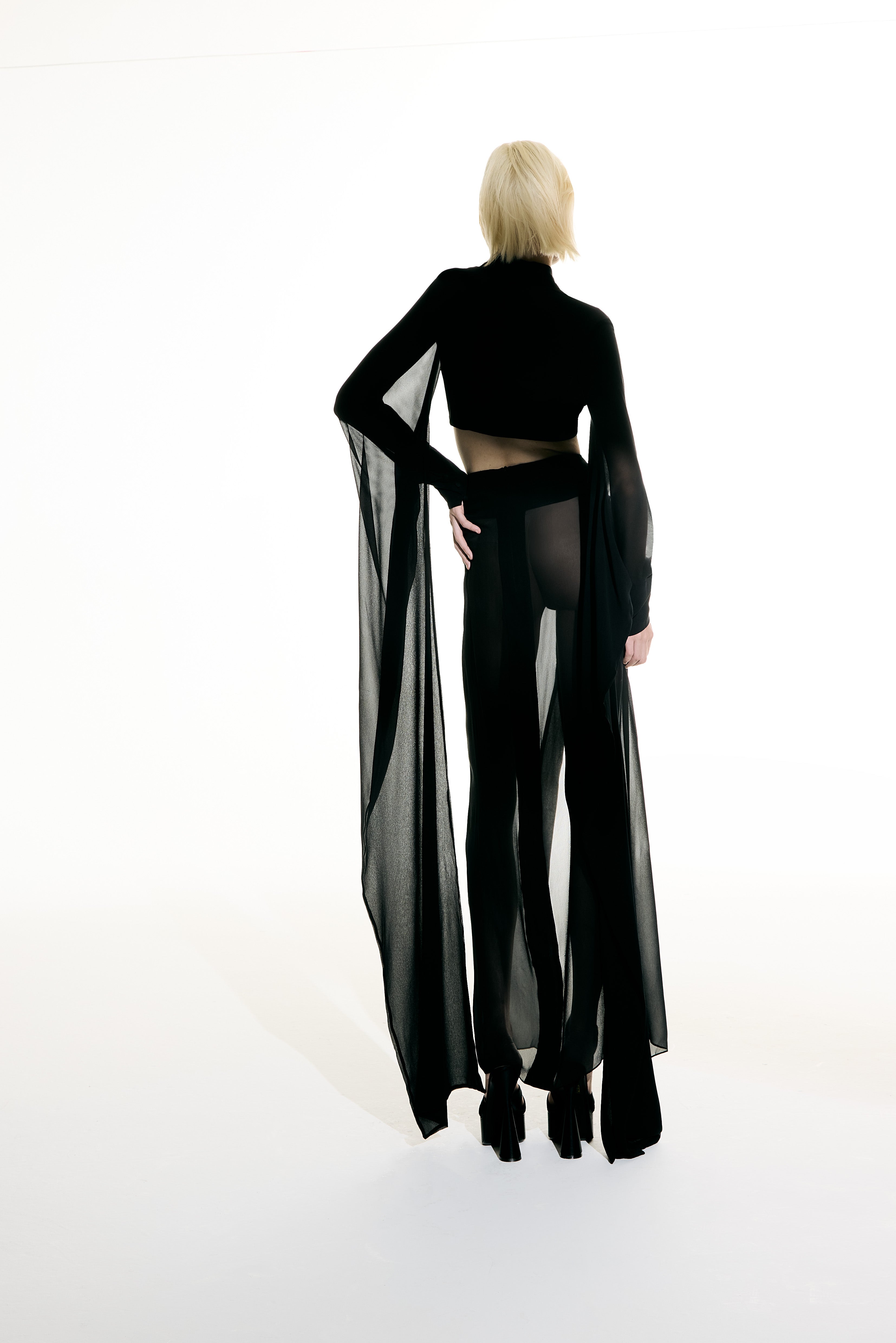 Model wearing the Maxi Skirt and Wide Sleeve Top Set back from the Adriana Degreas and Sabine Getty collab with 100% Silk styled for a dinner look.