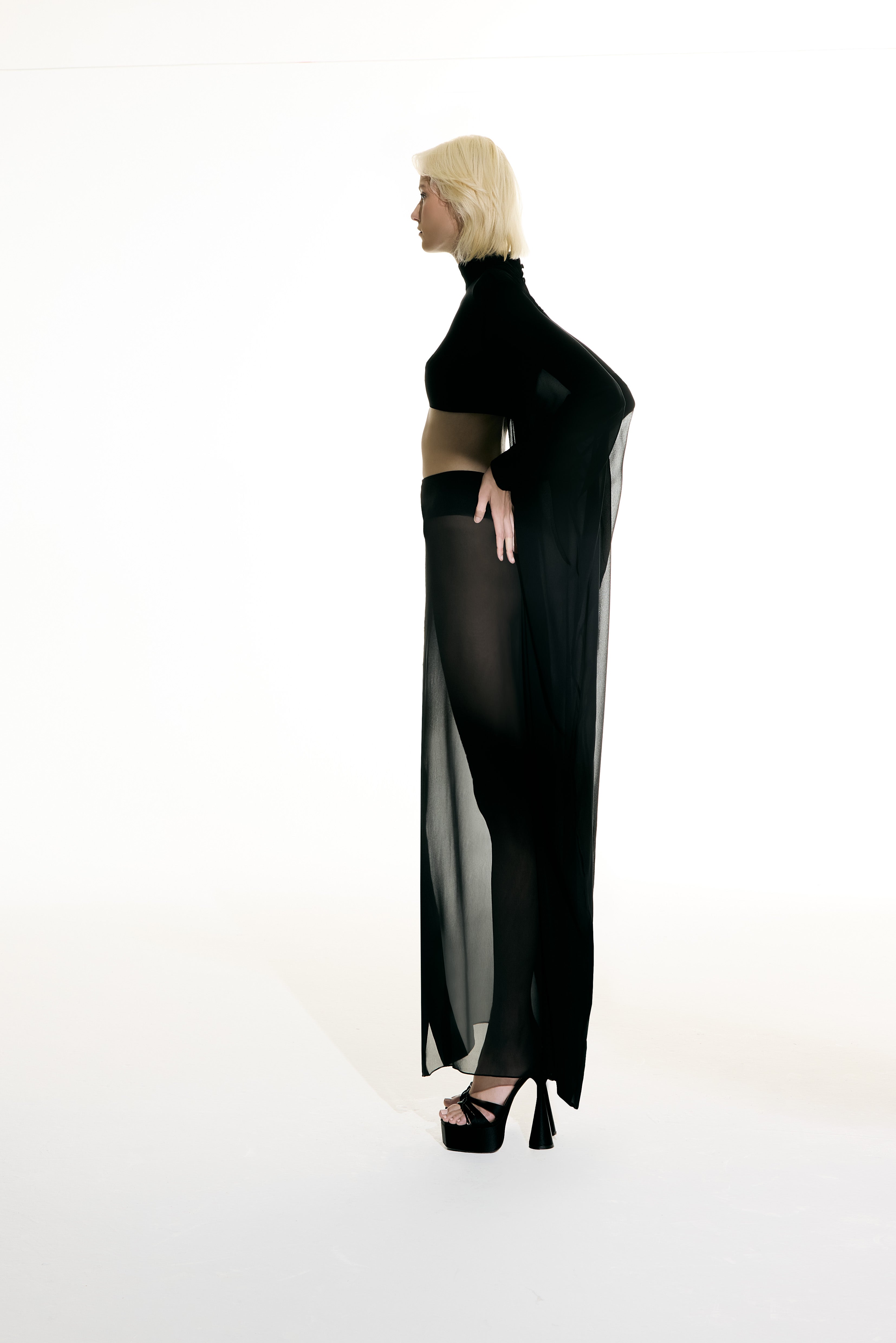 Model wearing the Maxi Skirt and Wide Sleeve Top Set concept from the Adriana Degreas and Sabine Getty collab with 100% Silk styled for a dinner look.