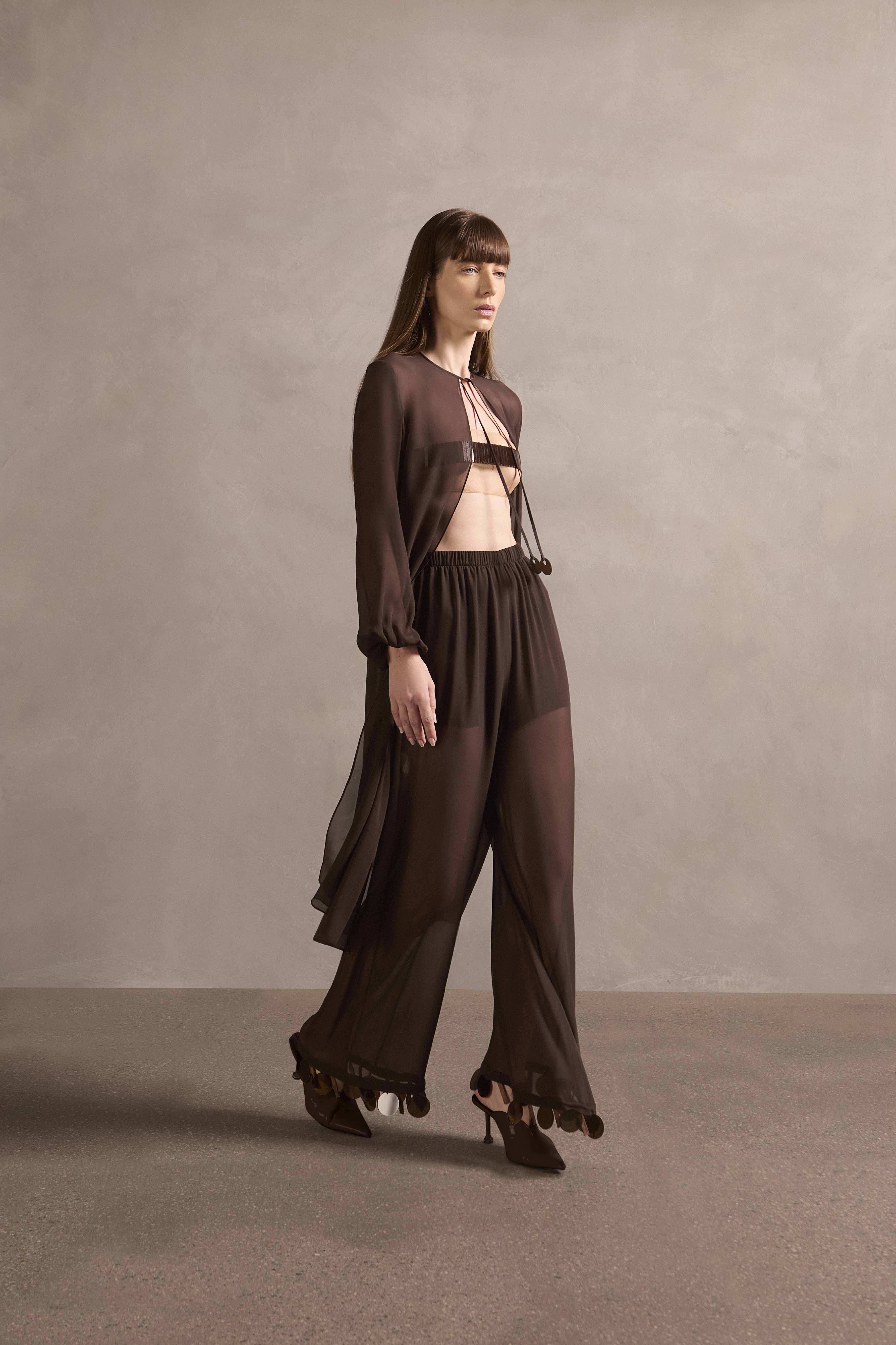Model wearing the Mobile Midi Robe With Pants showcasing its contemporary elements with coffee print on 100% silk fabric, styled for a night look.