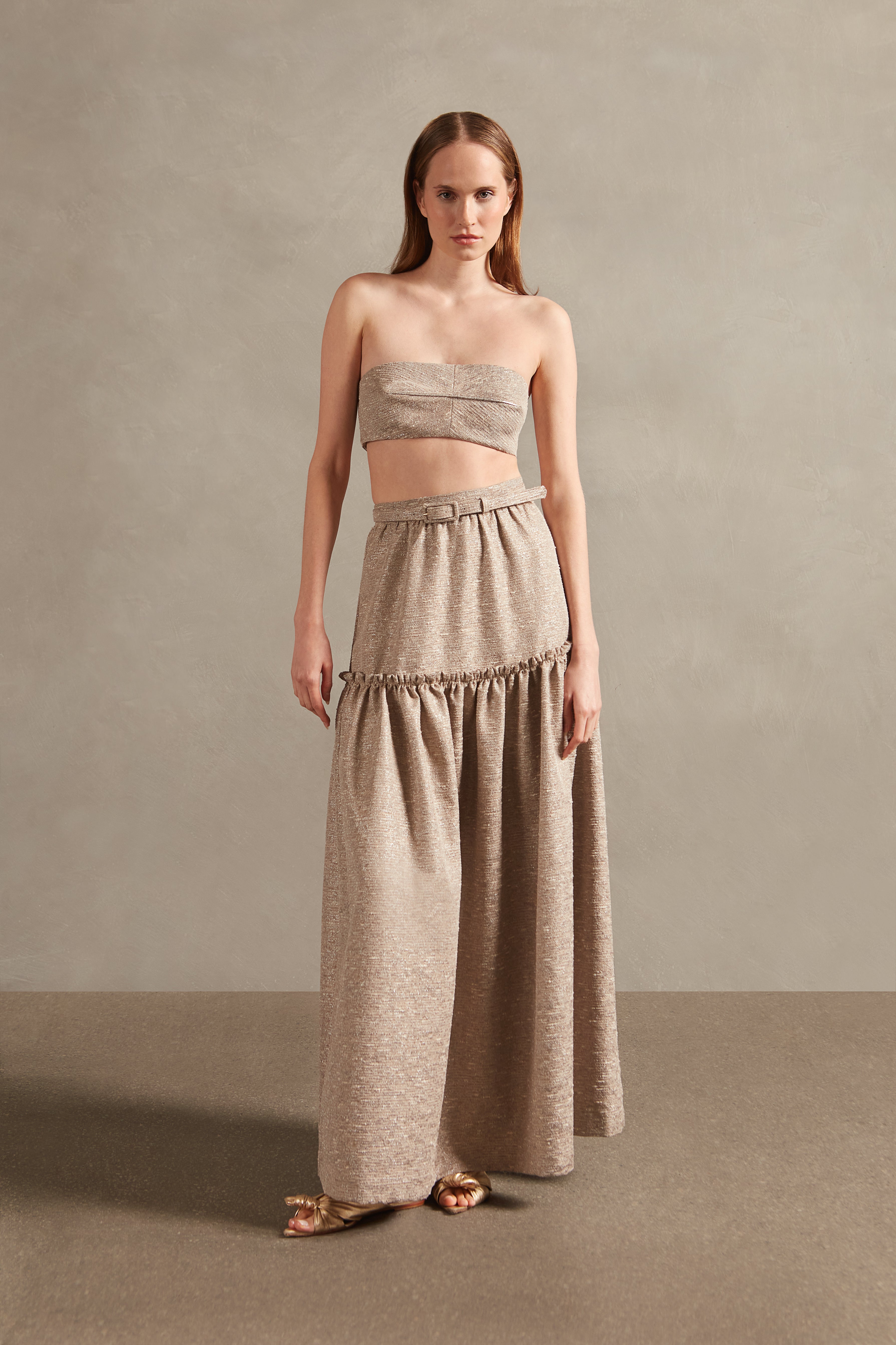 Model wearing theMoon Shine Frilled Long Skirt Front showcasing its Silver print on 58% Polyester 28% Cotton 9% Viscose 5% Acrilic fabric, styled for an evening look.