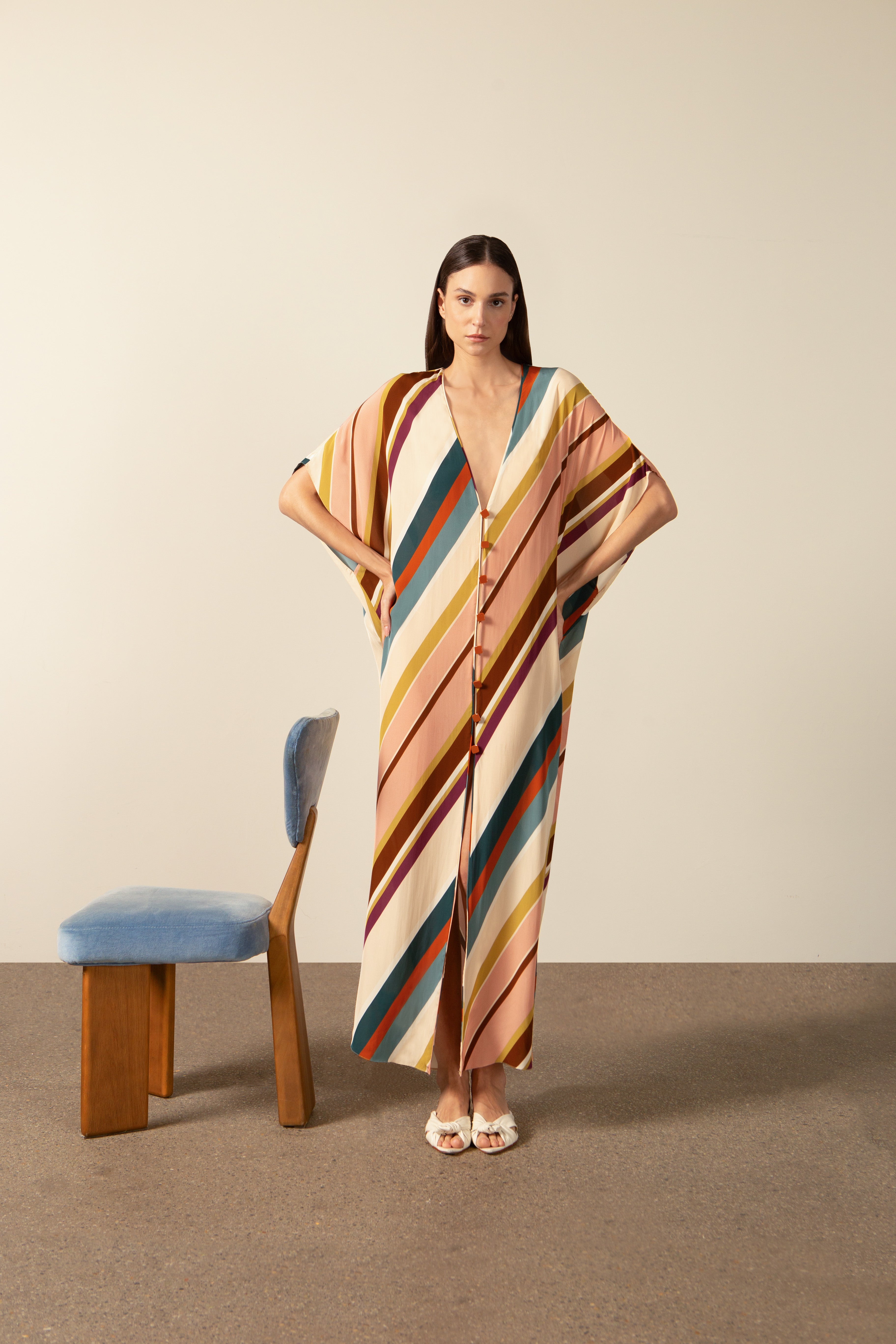 Model wearing the Organic Stripes Long Kaftan unique color pose from the HS25 with100% viscose styled for a lunch look.