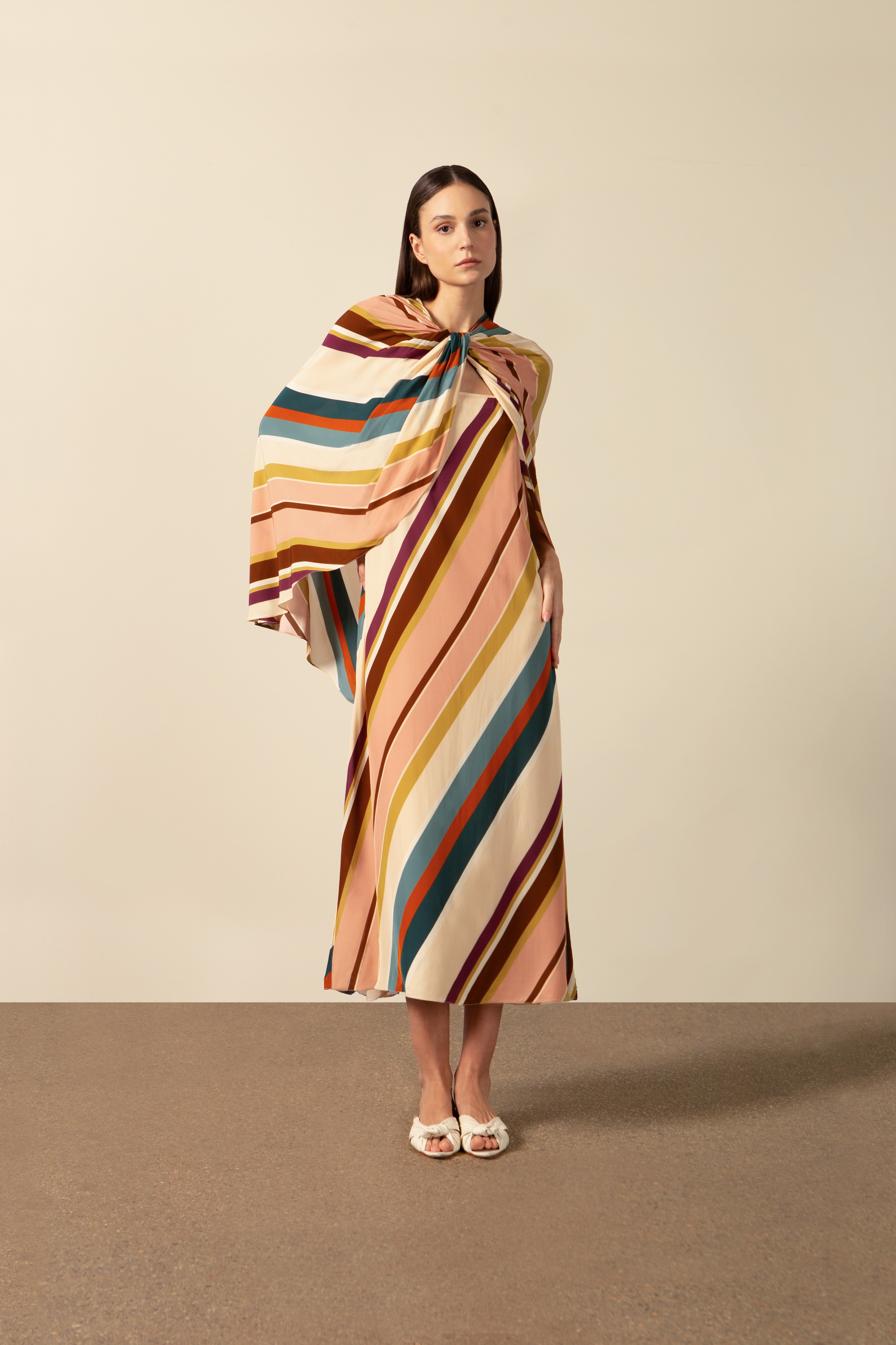 Model wearing the Organic Stripes Midi Dress unique color detail from the HS25 with 100% Viscose styled for a lunch look.