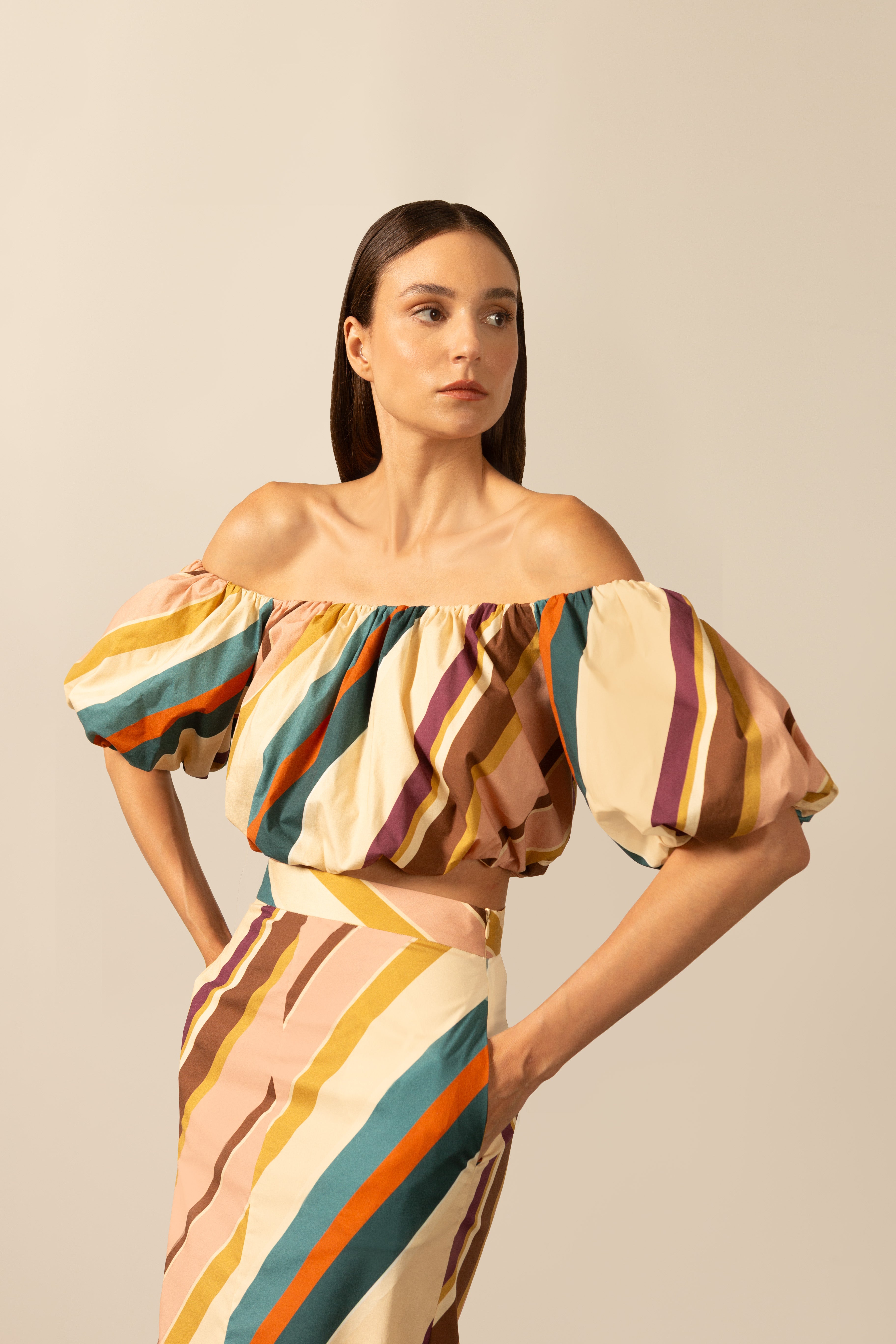 Model wearing the Organic Stripes Off-The-Shoulder Blouse unique color detail from the HS25 with 97% Cotton 03% Elastane styled for a lunch look.