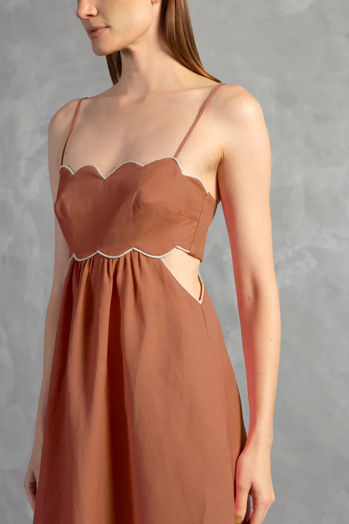Model wearing the Seashell Solid Cut-Out Long Dress Detail color Cognac styled for a resort look