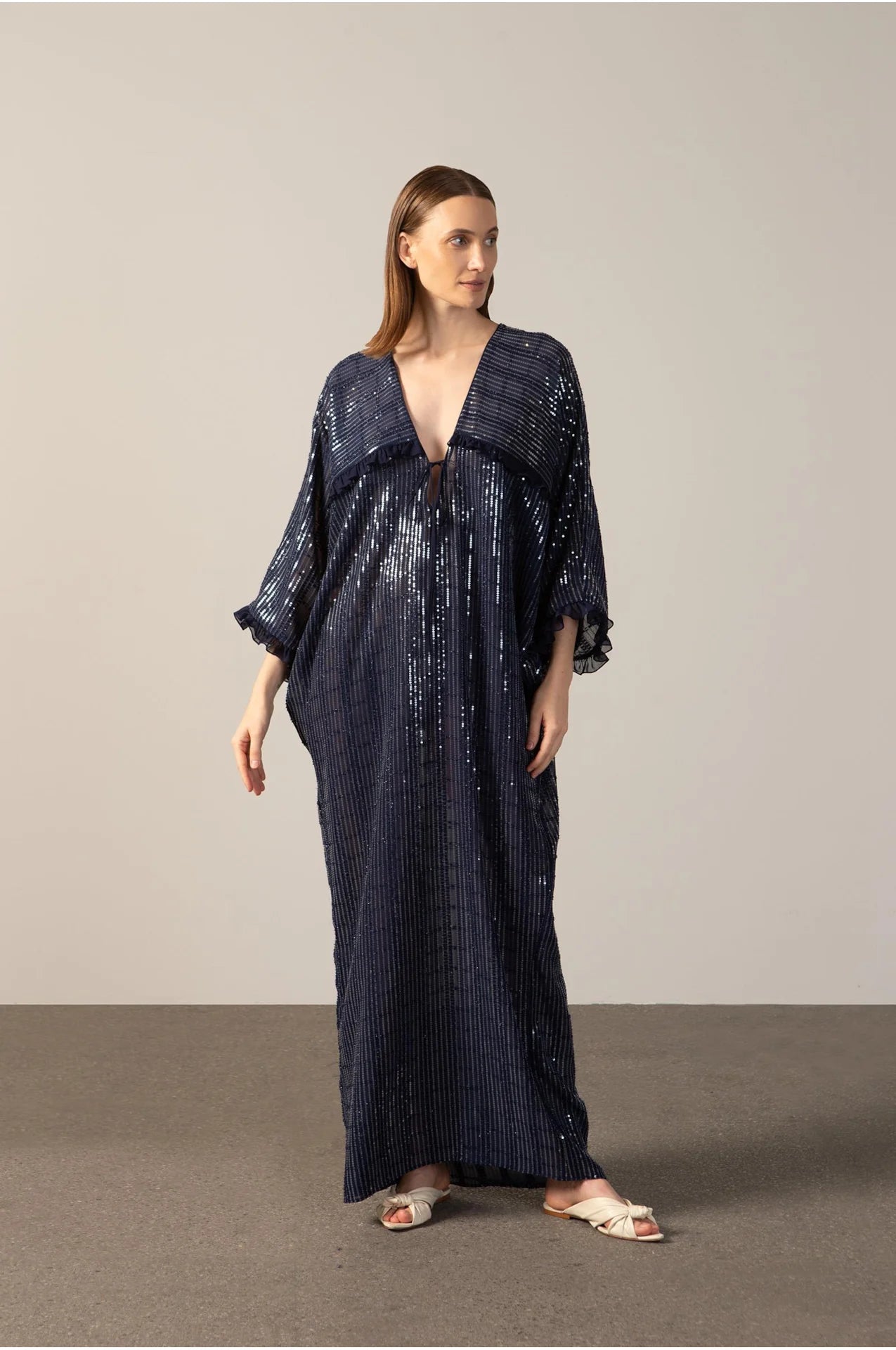 Model wearing the Sequins Maxi Kaftan navy color front from the HS25 with 100% polyester styled for a drinks at the boat look.