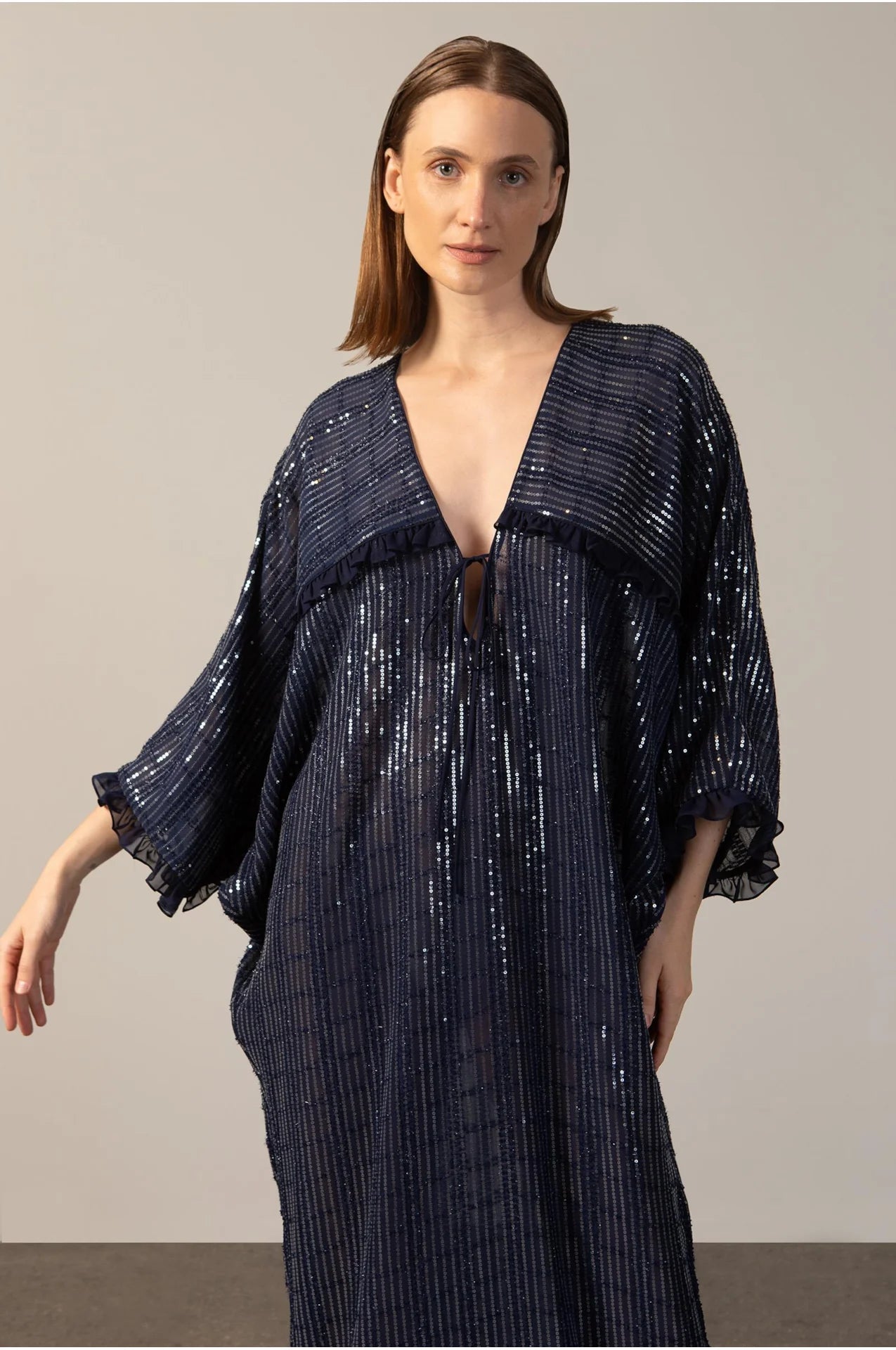 Model wearing the Sequins Maxi Kaftan detail navy color front from the HS25 with 100% polyester styled for a drinks at the boat look.