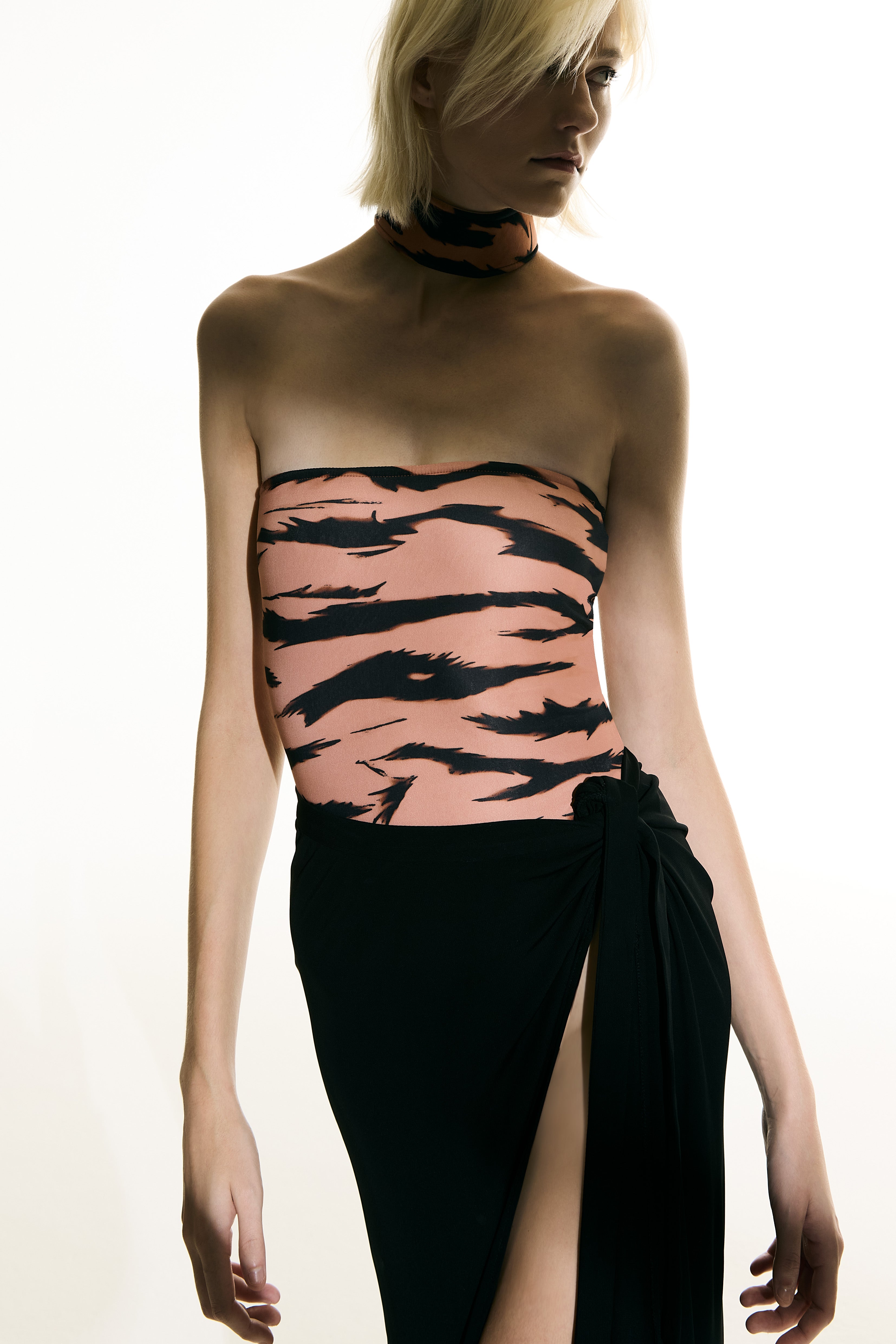 Model wearing the Side-Tie Maxi Skirt black detail from the Adriana Degreas and Sabine Getty collab with 100% Silk styled for a casual look.